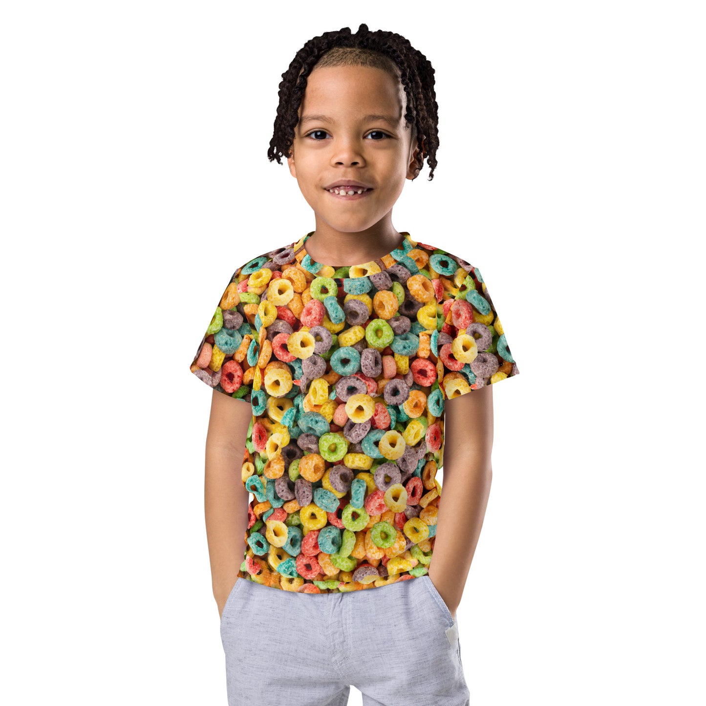 Little boy wearing an all over print Fruit Cereal Loops T-shirt, facing forward