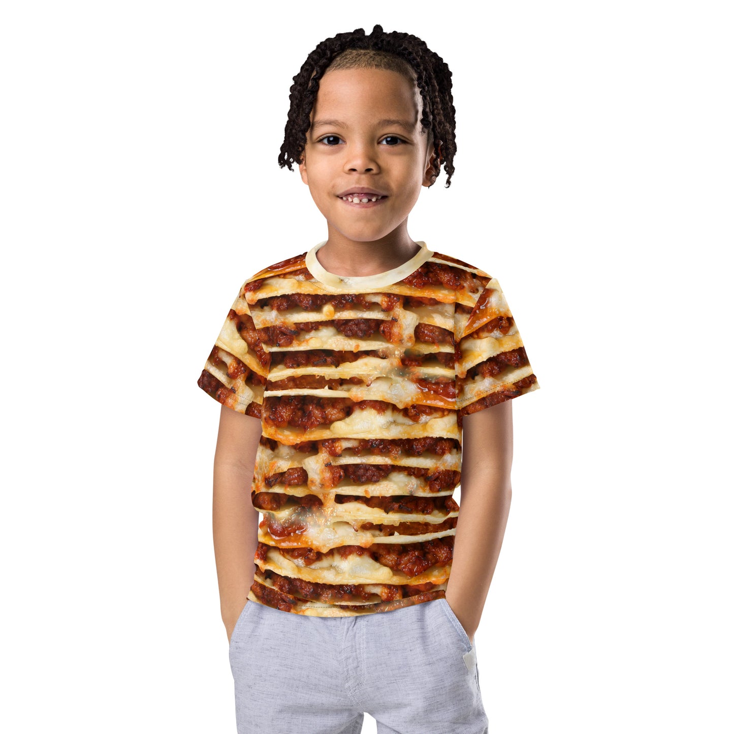 Little boy wearing an all over print lasagne layers kid's T-shirt, front view