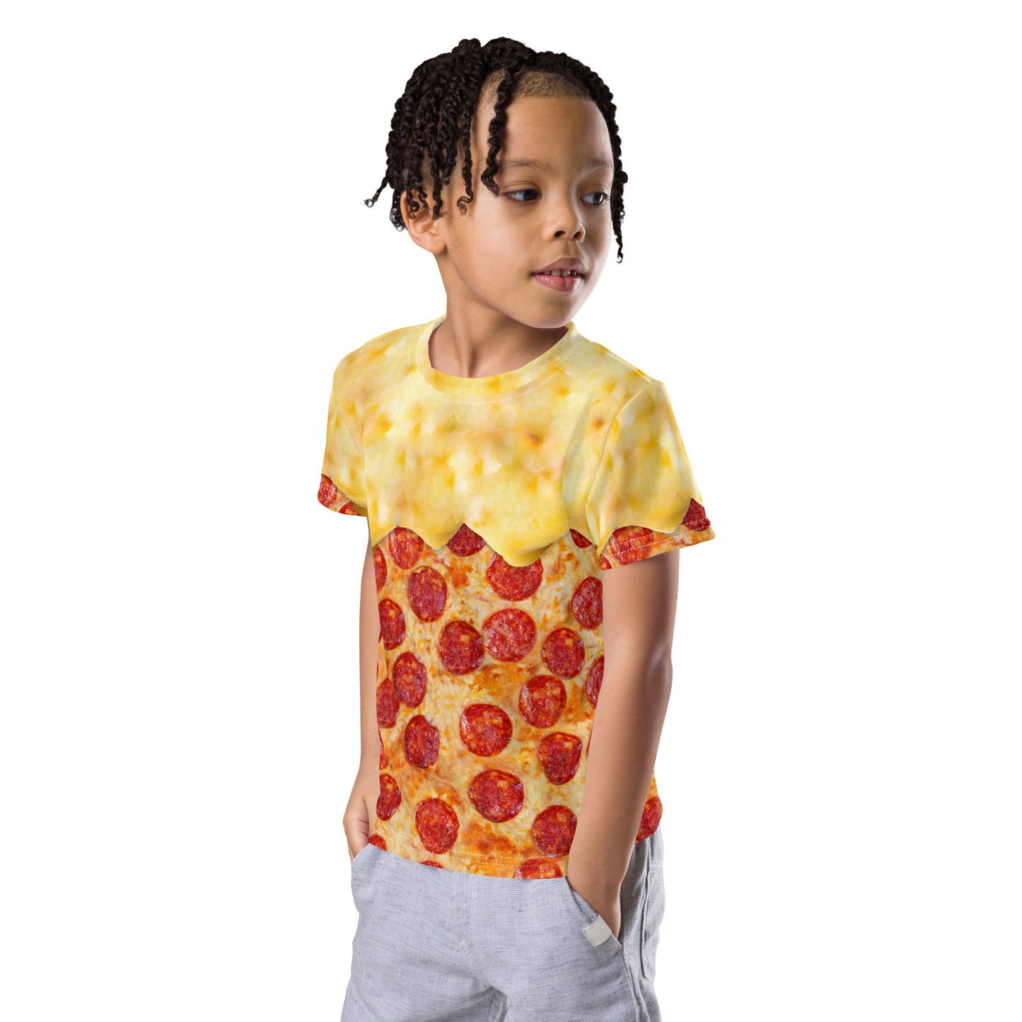 little boy wearing an all over print pepperoni pizza kid's t-shirt with cheese melting down from his shoulders, front left view