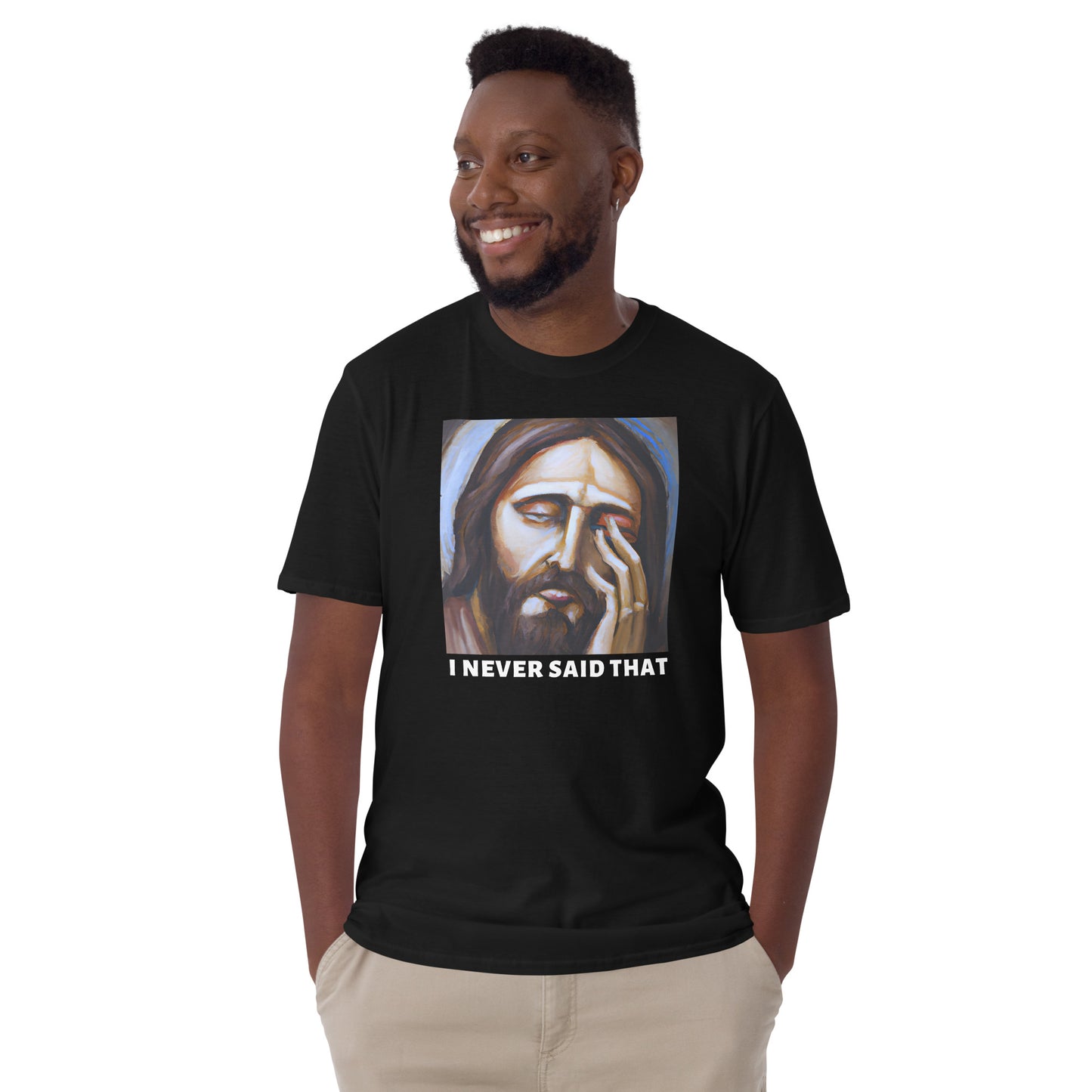 young man wearing a black t-shirt with a graphic of Jesus with his hand over his face that reads I never said that