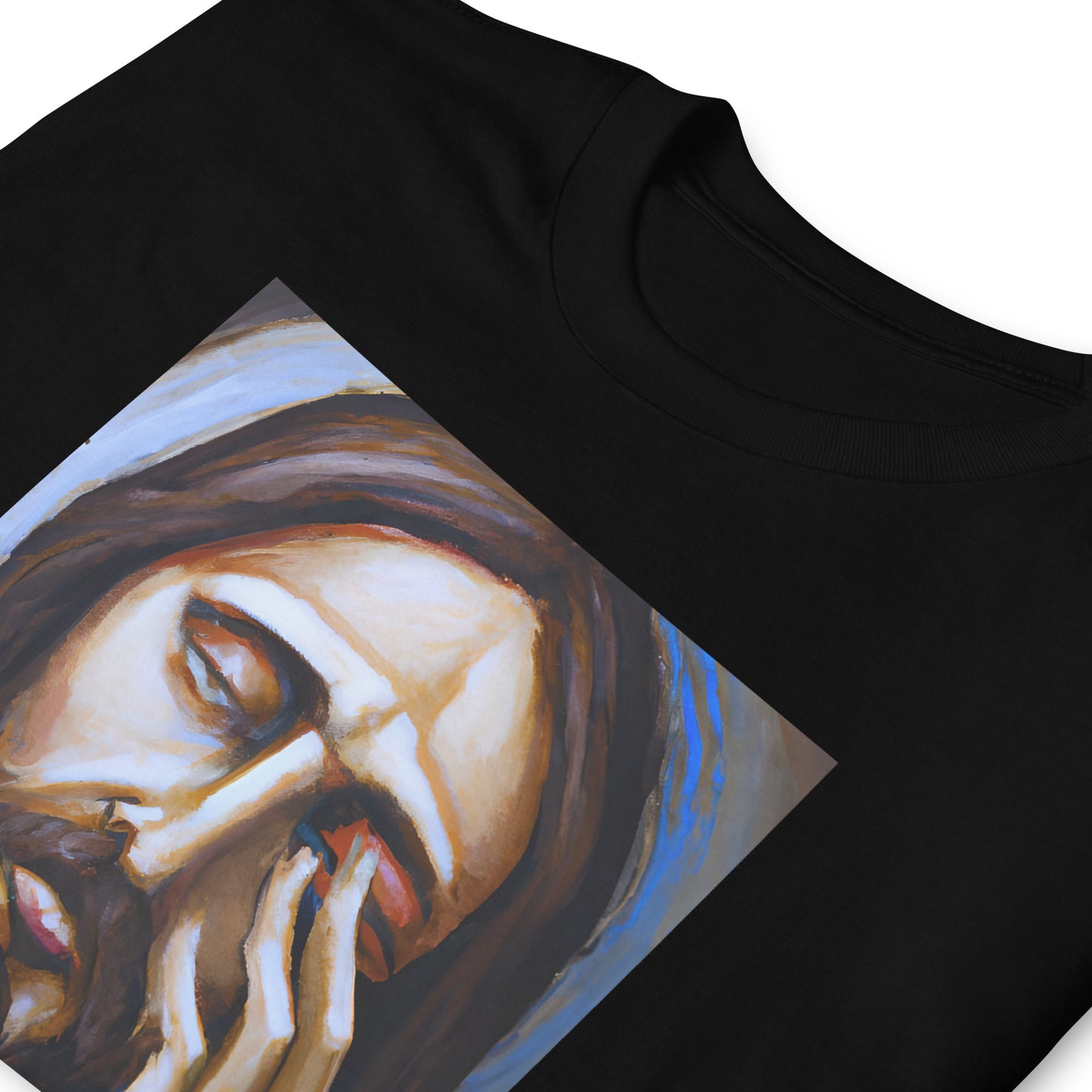 folded black t-shirt with a graphic of Jesus with his hand over his face that reads I never said that