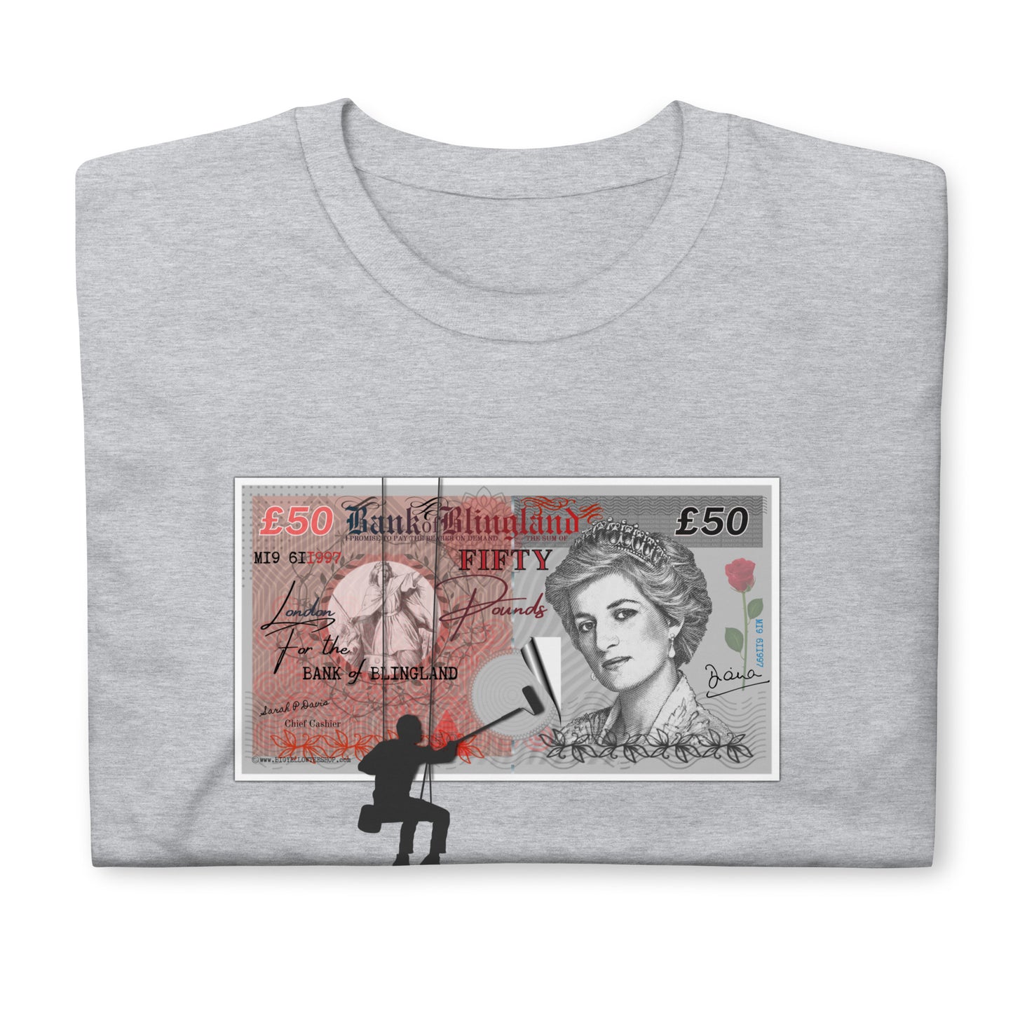Folded sport grey T-shirt featuring a spoof £50 note with Princess Diana on it, the money is being posted to a wall by a silhouetted man.