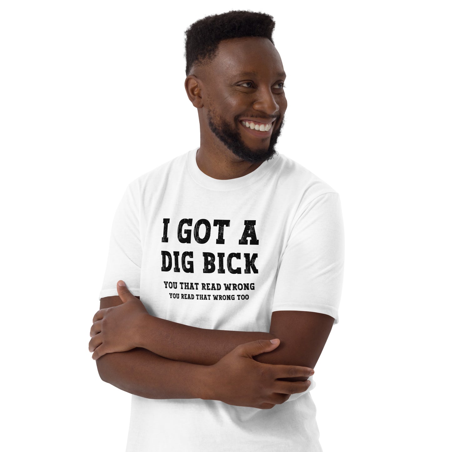 Amused young man wearing a white I got a Dig Bick Optical Illusion T-shirt that reads 'I got a Dig Bick, You That Read Wrong, You read that wrong too'.