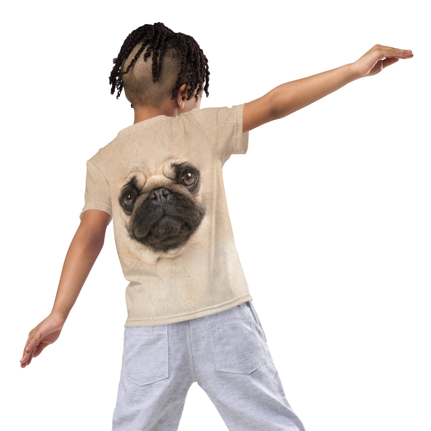 Little boy pretending to be an aeroplane wearing the pug face t-shirt.