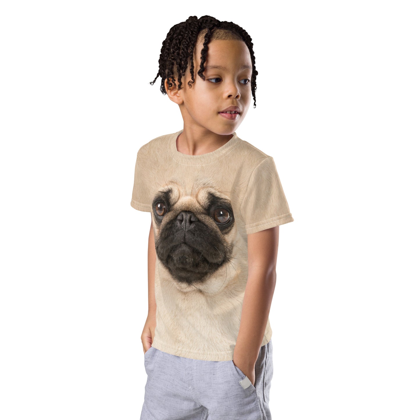 Little boy with hands in pockets wearing the pug face t-shirt with pug face print on the front and the back.