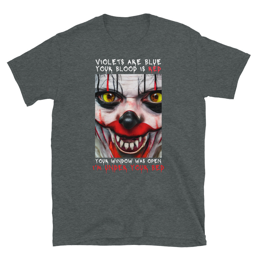 Scary Clown Halloween T shirt that shows a creepy clowns face with text that reads Violets are blue, your blood is red, your window was open, I'm under your bed. Dark grey T shirt laid flat.