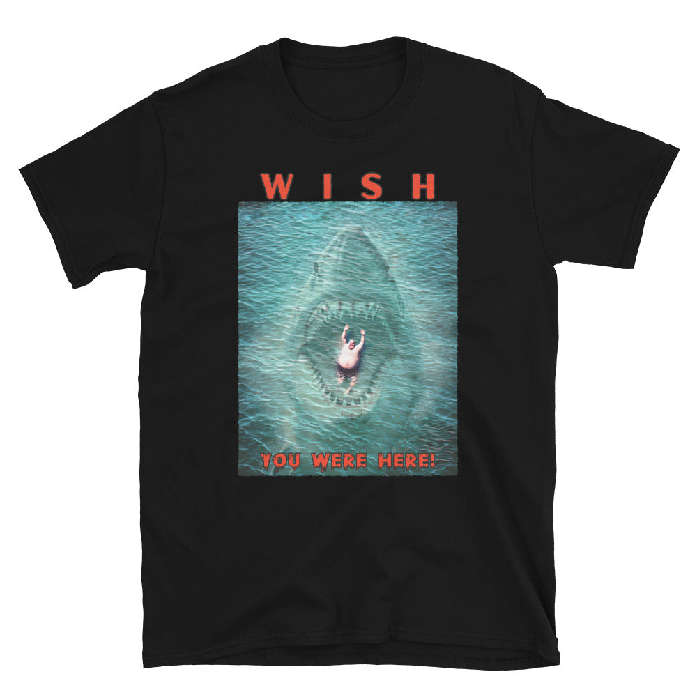 Black, funny T-shirt with an image of a fat guy floating in the sea, with a large shark with its jaws open coming up underneath him, text reads, Wish you were here