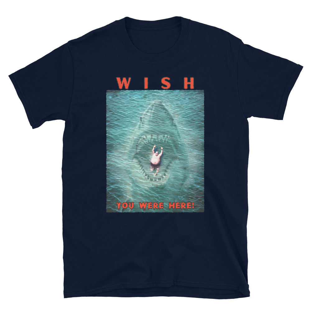 Navy, funny T-shirt with an image of a fat guy floating in the sea, with a large shark with its jaws open coming up underneath him, text reads, Wish you were here