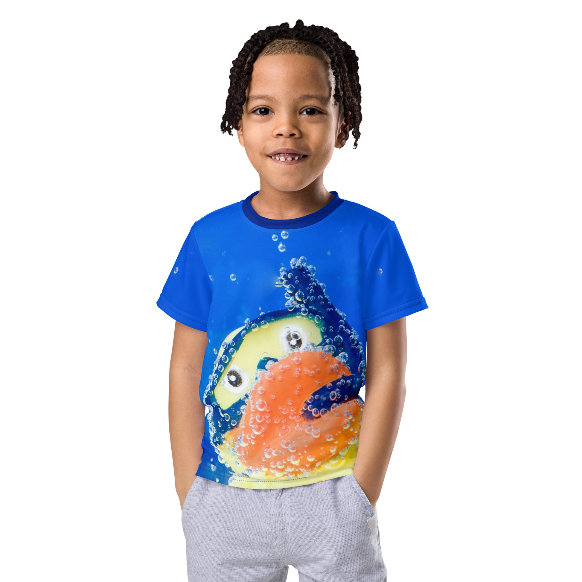 Little boy wearing an All over print Rubber Duck Snorkelling Underwater T-shirt, front view.