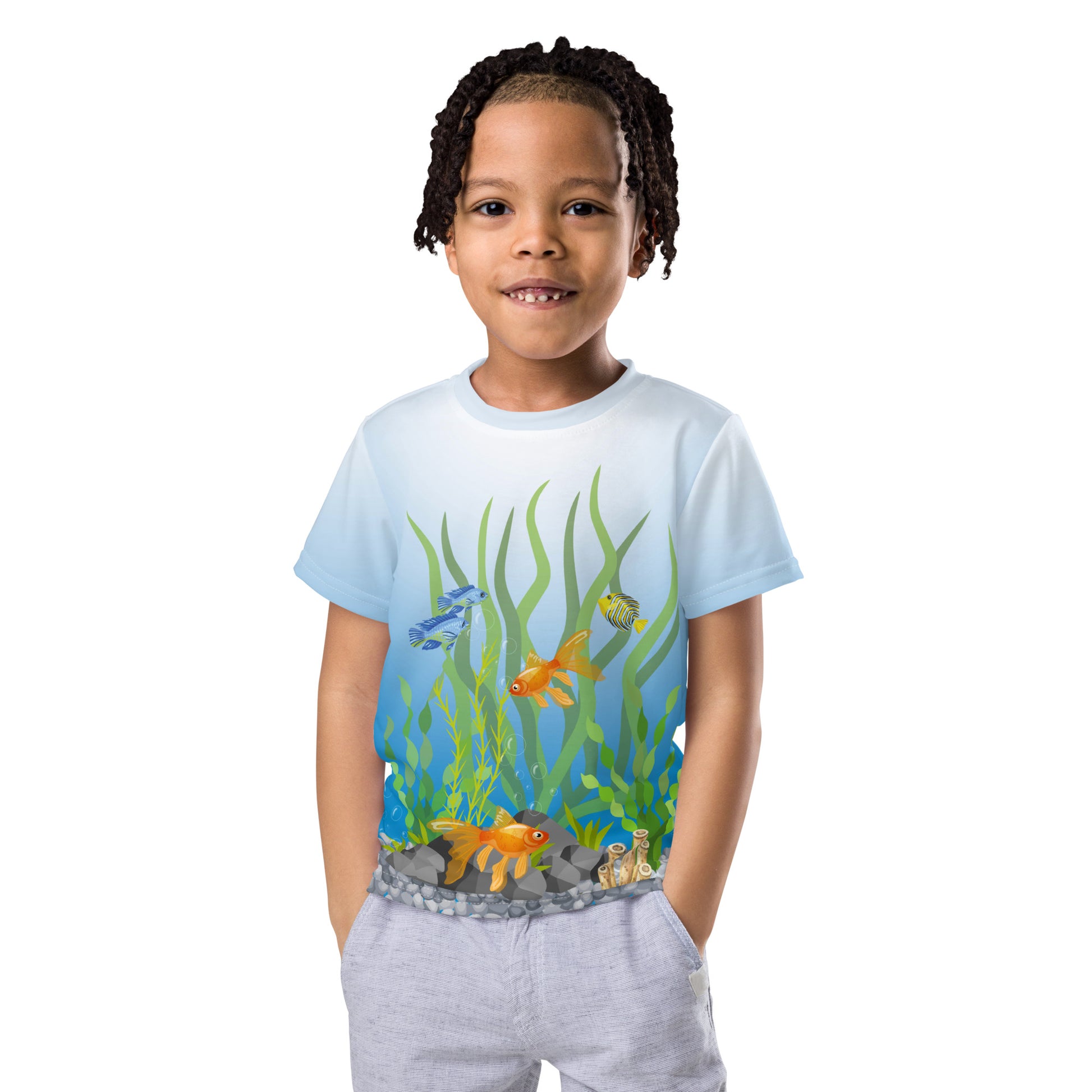 Little boy wearing a tropical fish aquarium scene all over print T-shirt, facing forward