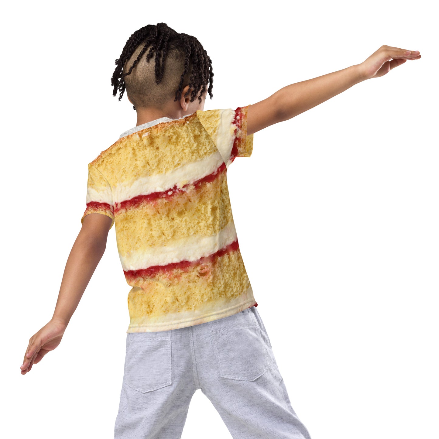 Boy wearing Victoria sponge cake layers with fresh cream and jam, all over print kid's T-shirt, rear view child playing