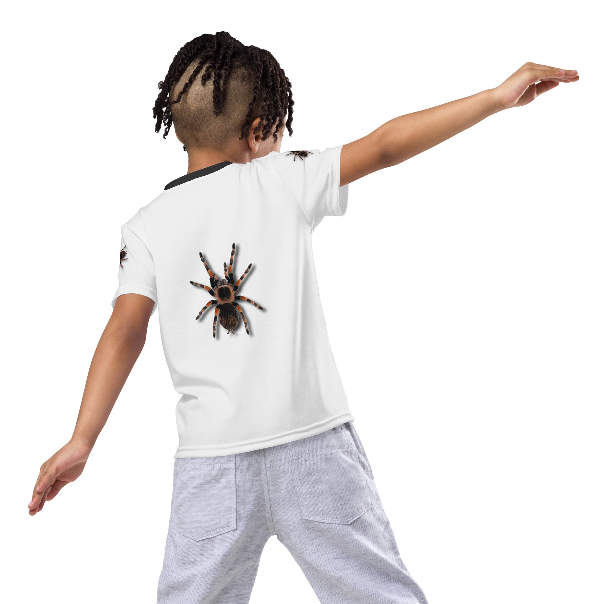 Little boy wearing a 3D Tarantula spider T-shirt with one spider on each arm, front and back of shirt. Rear view.