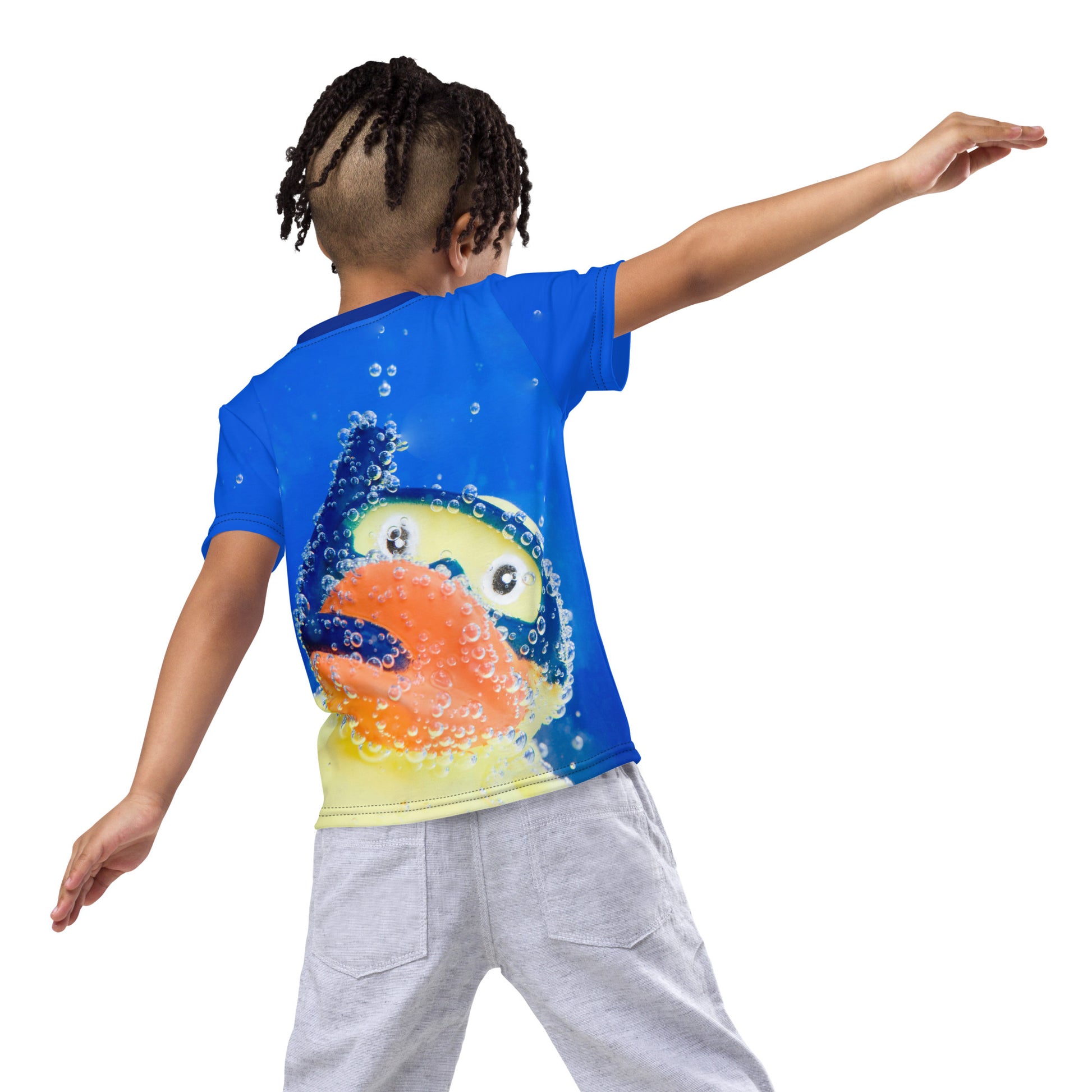 Little boy wearing an All over print Rubber Duck Snorkelling Underwater T-shirt, rear view.