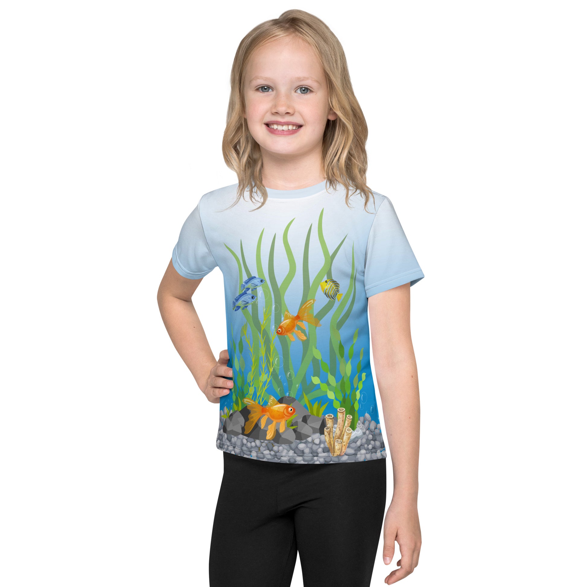 Little girl wearing a tropical fish aquarium scene all over print T-shirt, facing forward