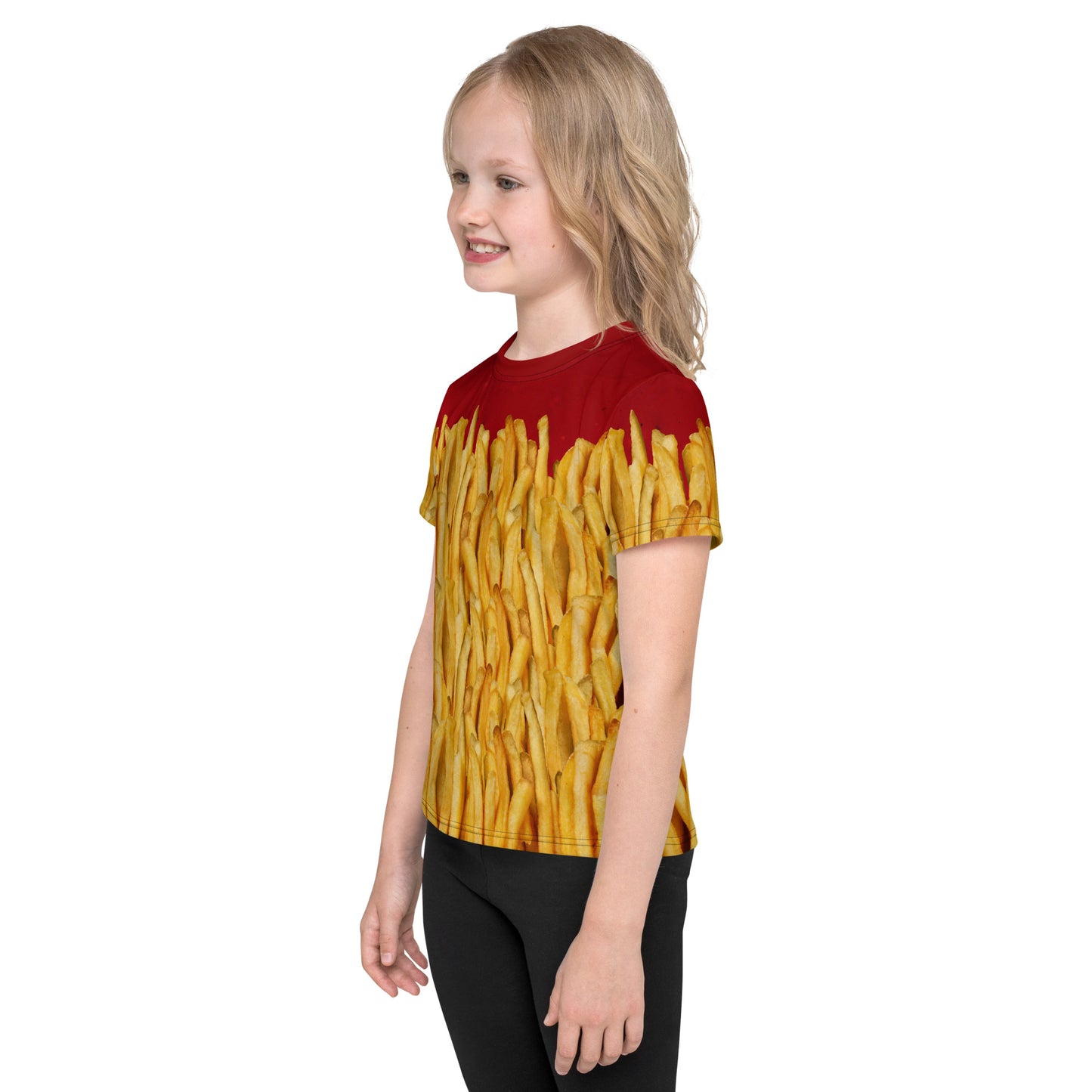 Little girl wearing a french fries and ketchup all over print T-shirt, left side view.