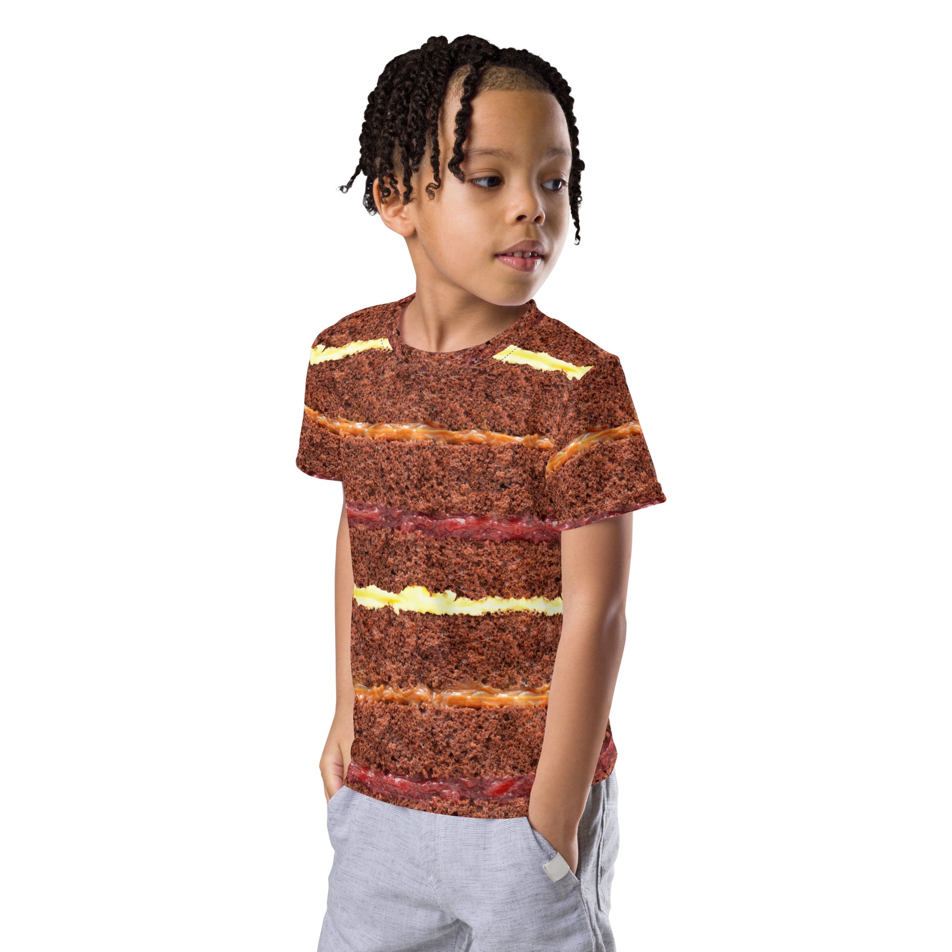 Little boy wearing chocolate cake all over print kid's T-shirt front left view