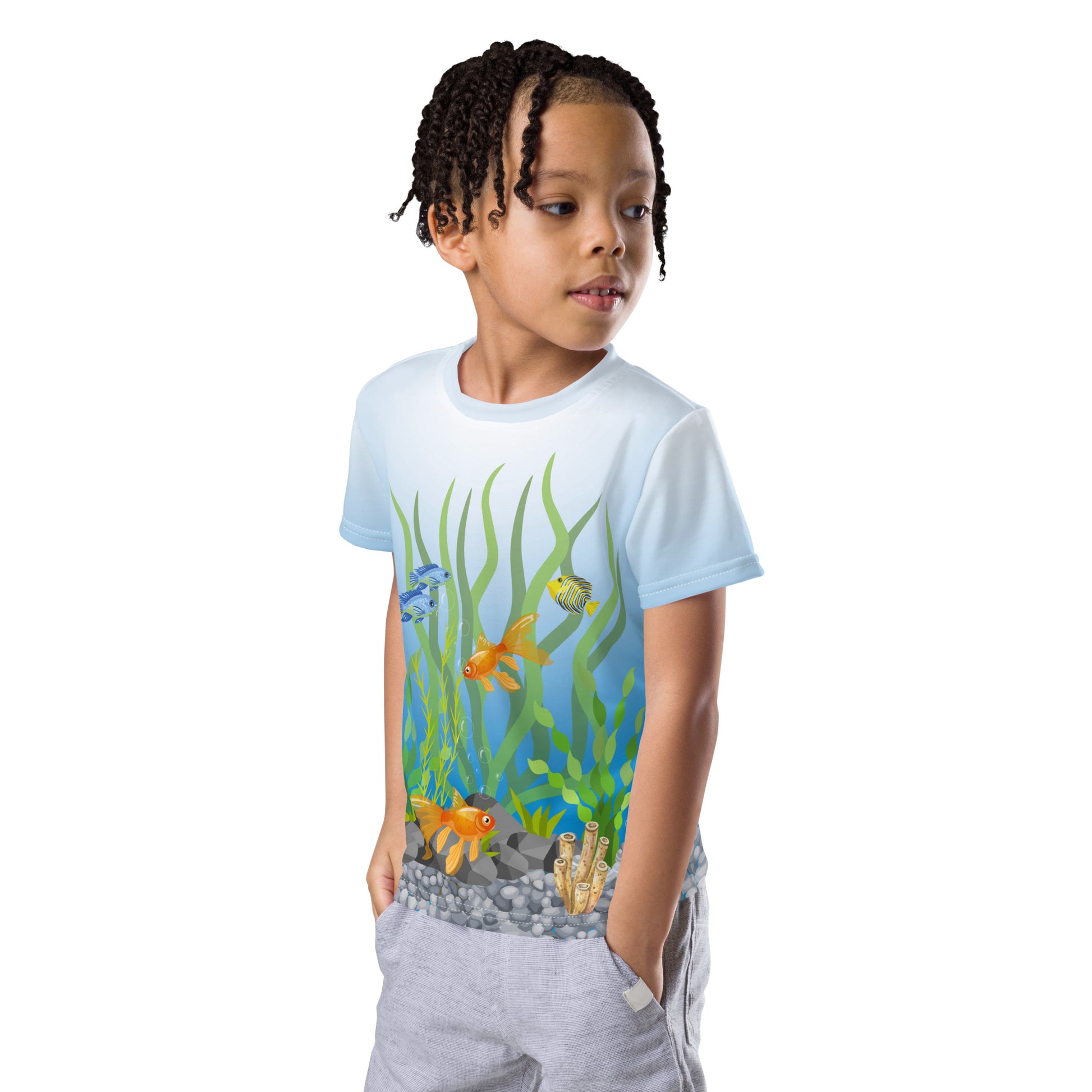 Little boy wearing a tropical fish aquarium scene all over print T-shirt, front left view