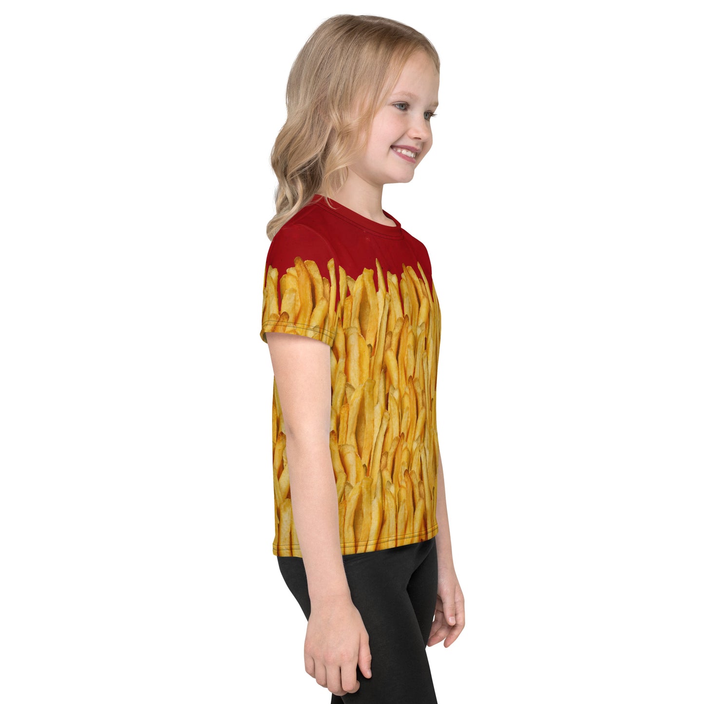 Little girl wearing a french fries and ketchup all over print T-shirt, right side view.