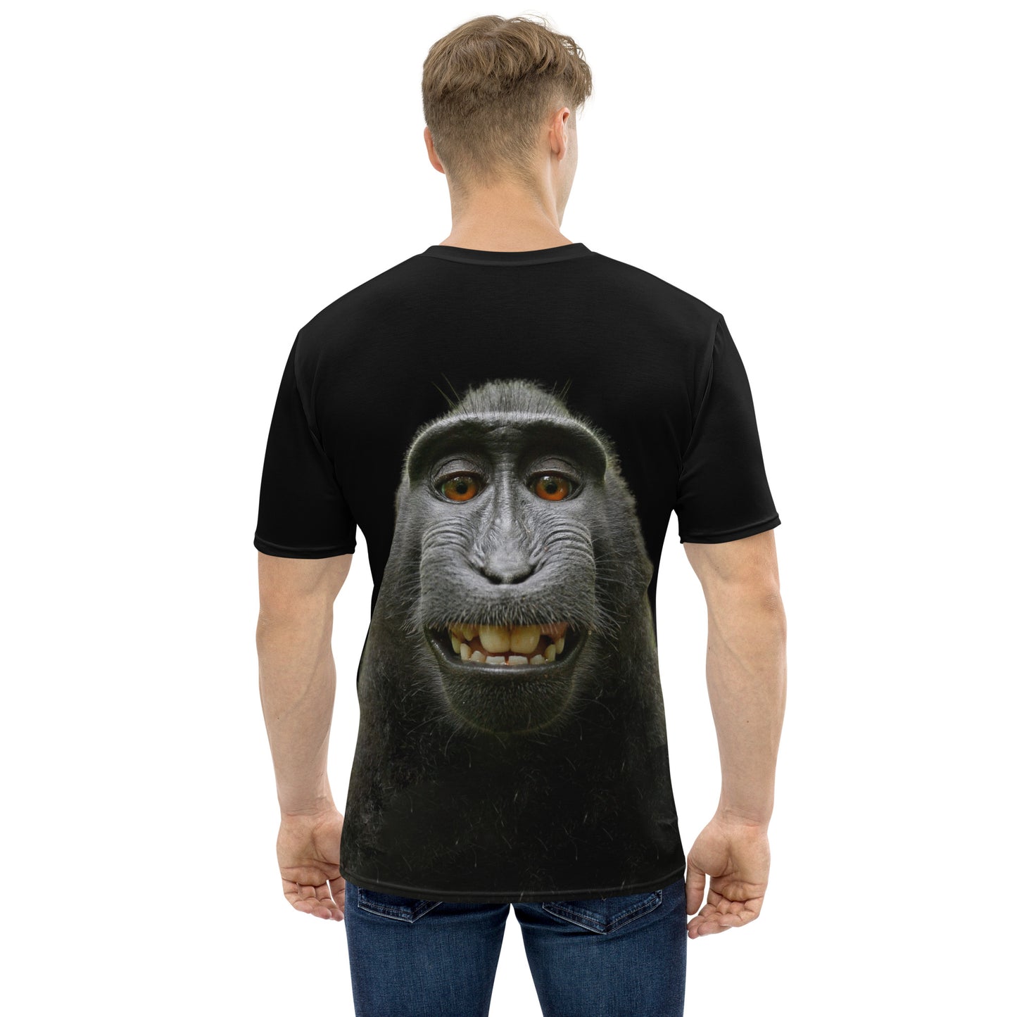 Young man wearing a Funny monkey face all over print men's T-shirt, rear view.