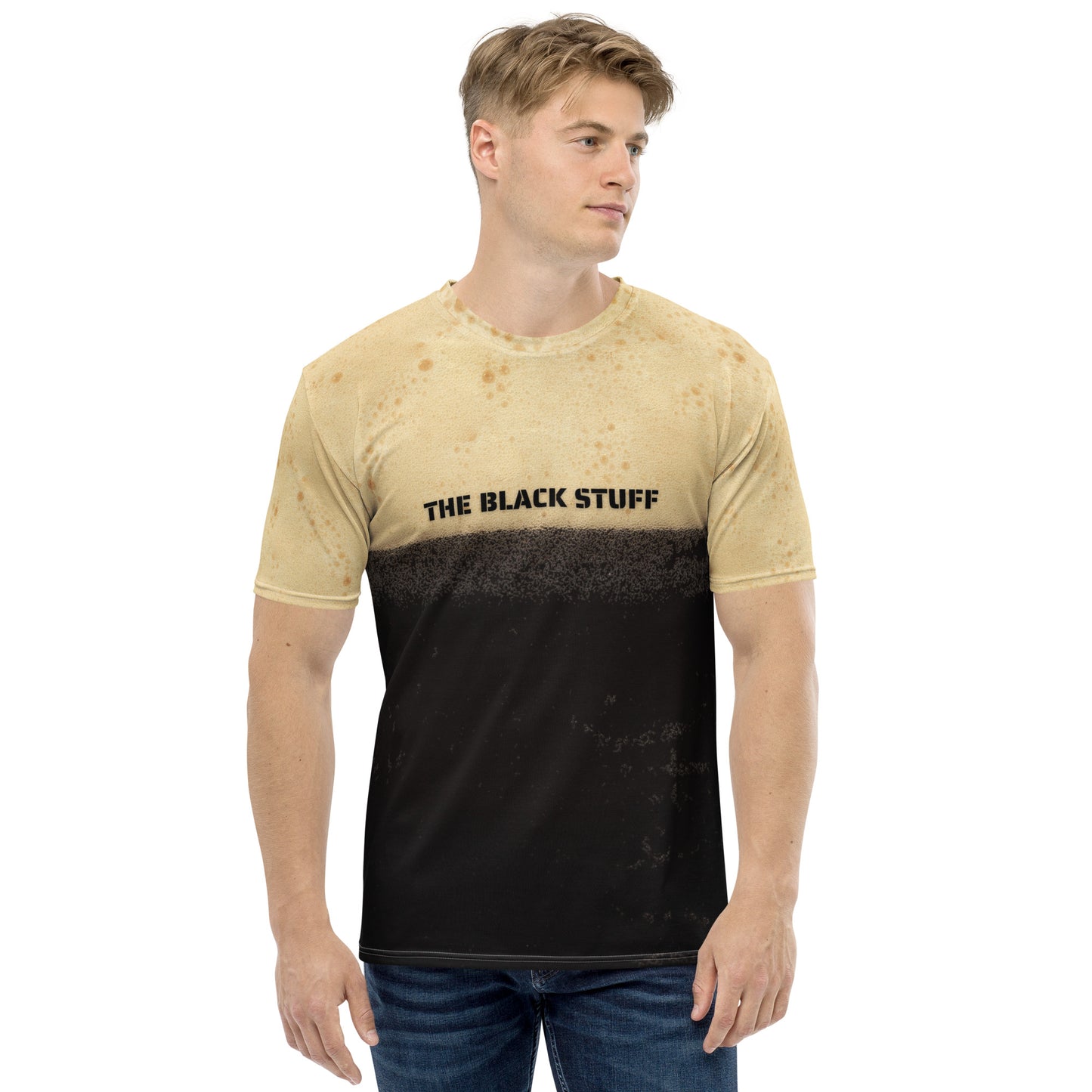 Male model wearing Irish stout bubbles all over print men's T-shirt with text that reads The Black Stuff