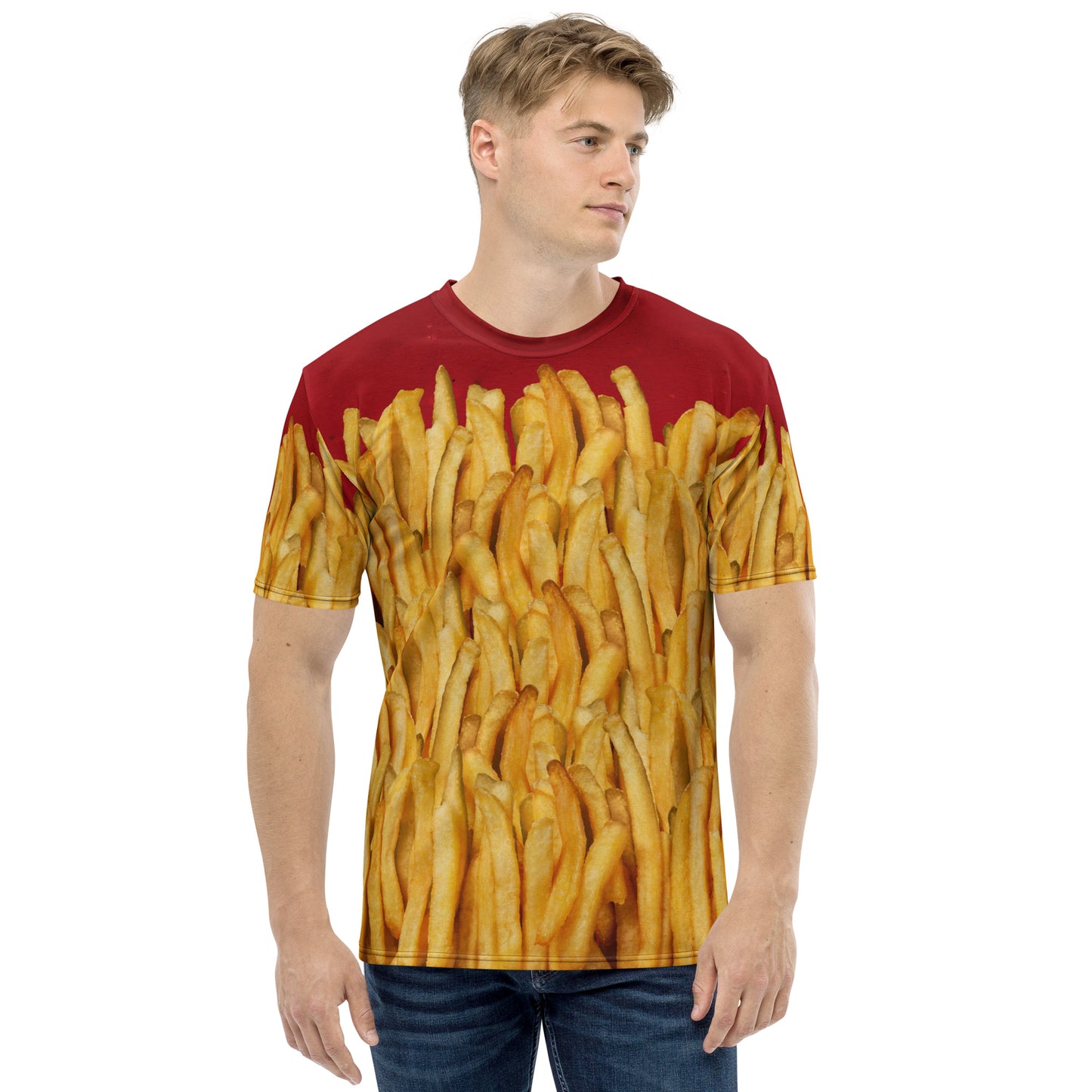 Young man wearing a men's all over print T-shirt with a ketchup base, then layered with golden french fries, delicious! Front view.