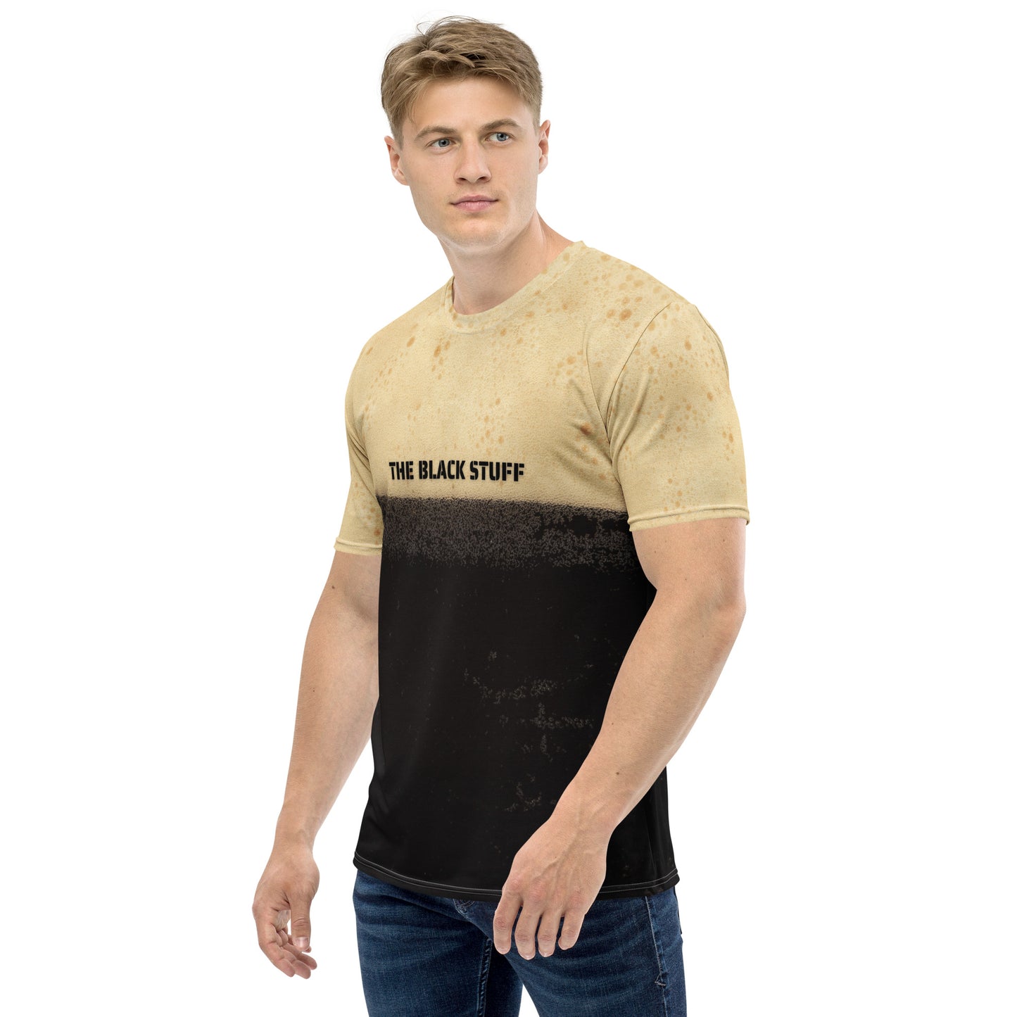 Male model wearing Irish stout bubbles all over print men's T-shirt with text that reads The Black Stuff, front left view