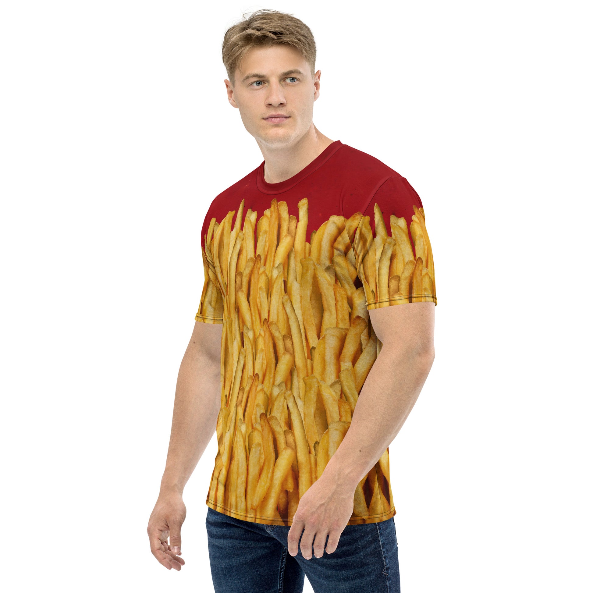 Young man wearing a men's all over print T-shirt with a ketchup base, then layered with golden french fries, delicious! Front left view.