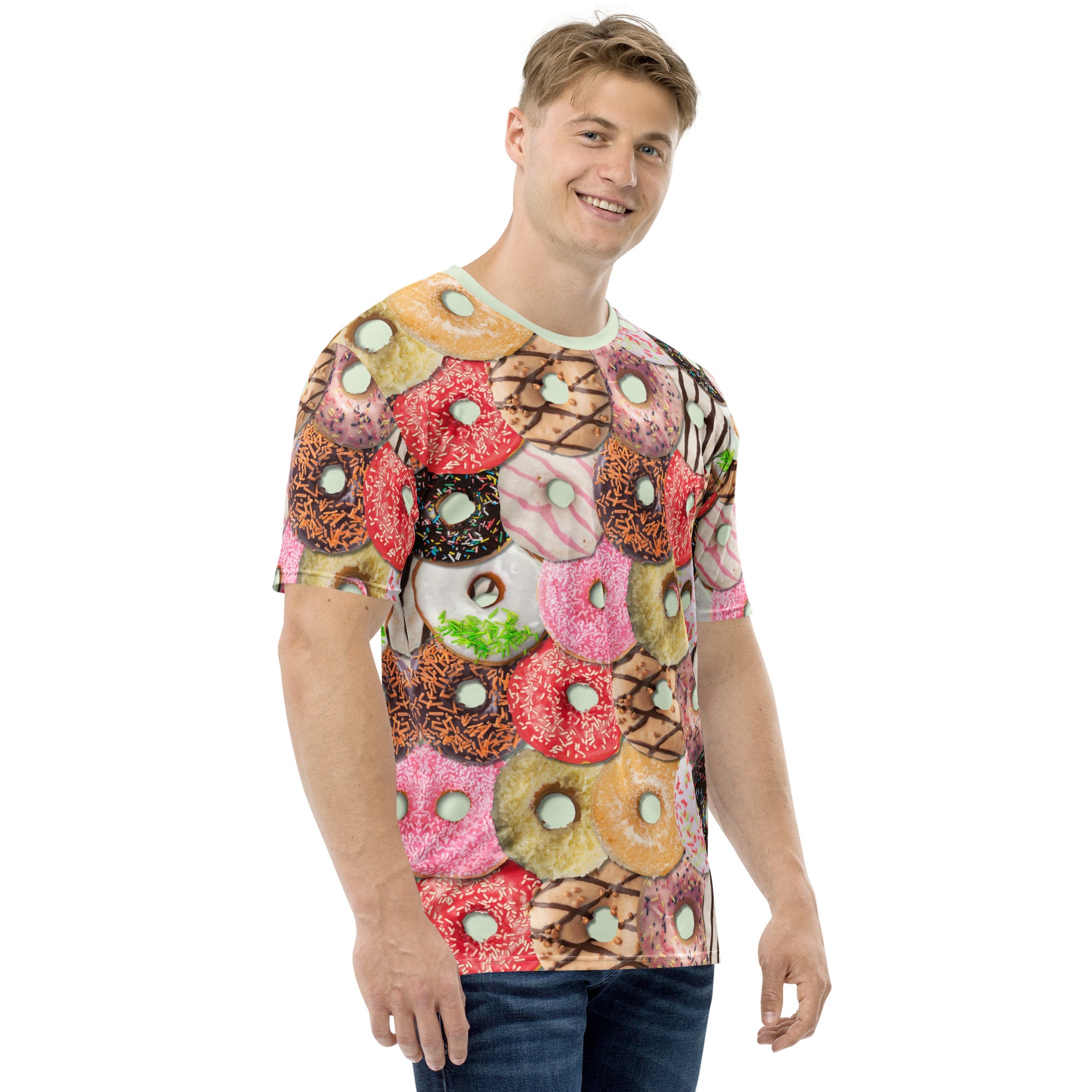 Happy young man wearing a Men's all over print Iced Doughnuts T-shirt, front right view.