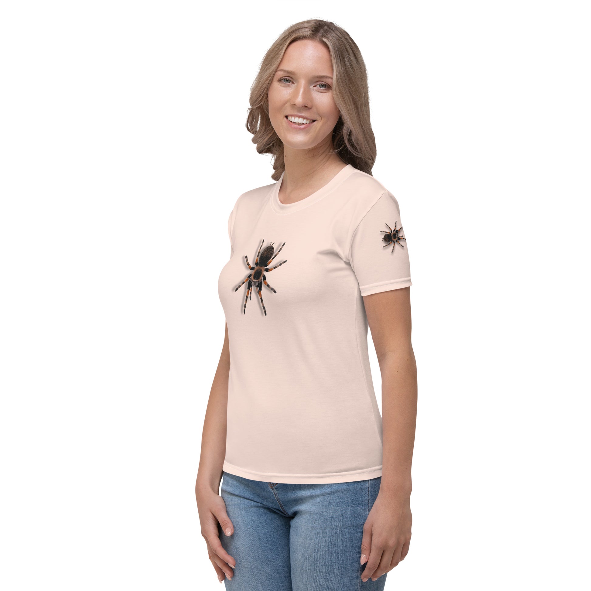 woman wearing a pale pink t-shirt with realistic looking 3D Tarantula spiders on both arms, back and front, front left view