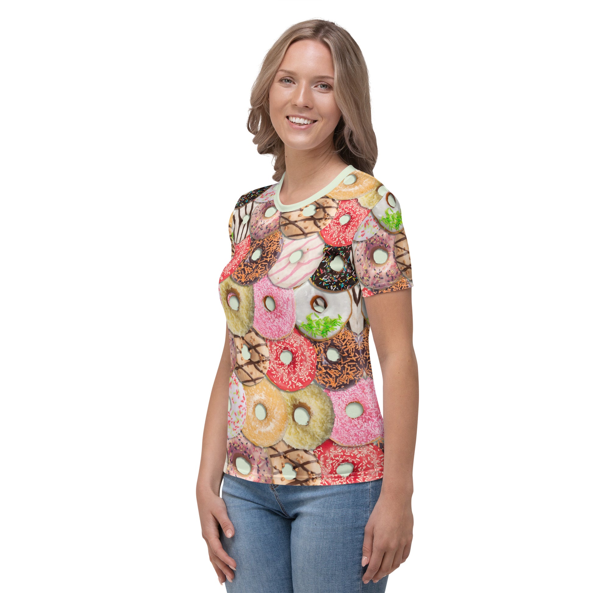 Young woman wearing an iced doughnuts all over print T-shirt, front left view.