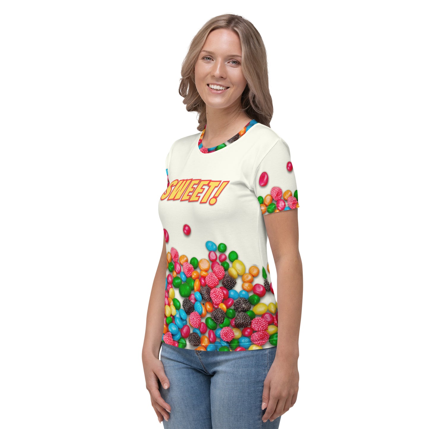 young woman wearing an all over print colourful Candy print T-shirt with SWEET!  on the front, front left view.