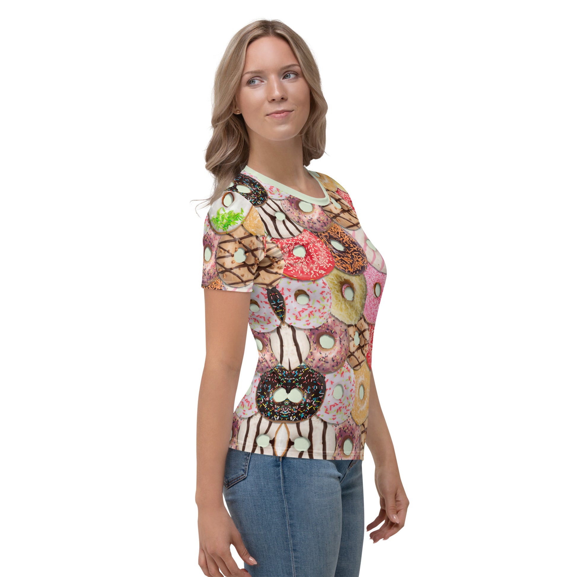 Young woman wearing an iced doughnuts all over print T-shirt, right side view.