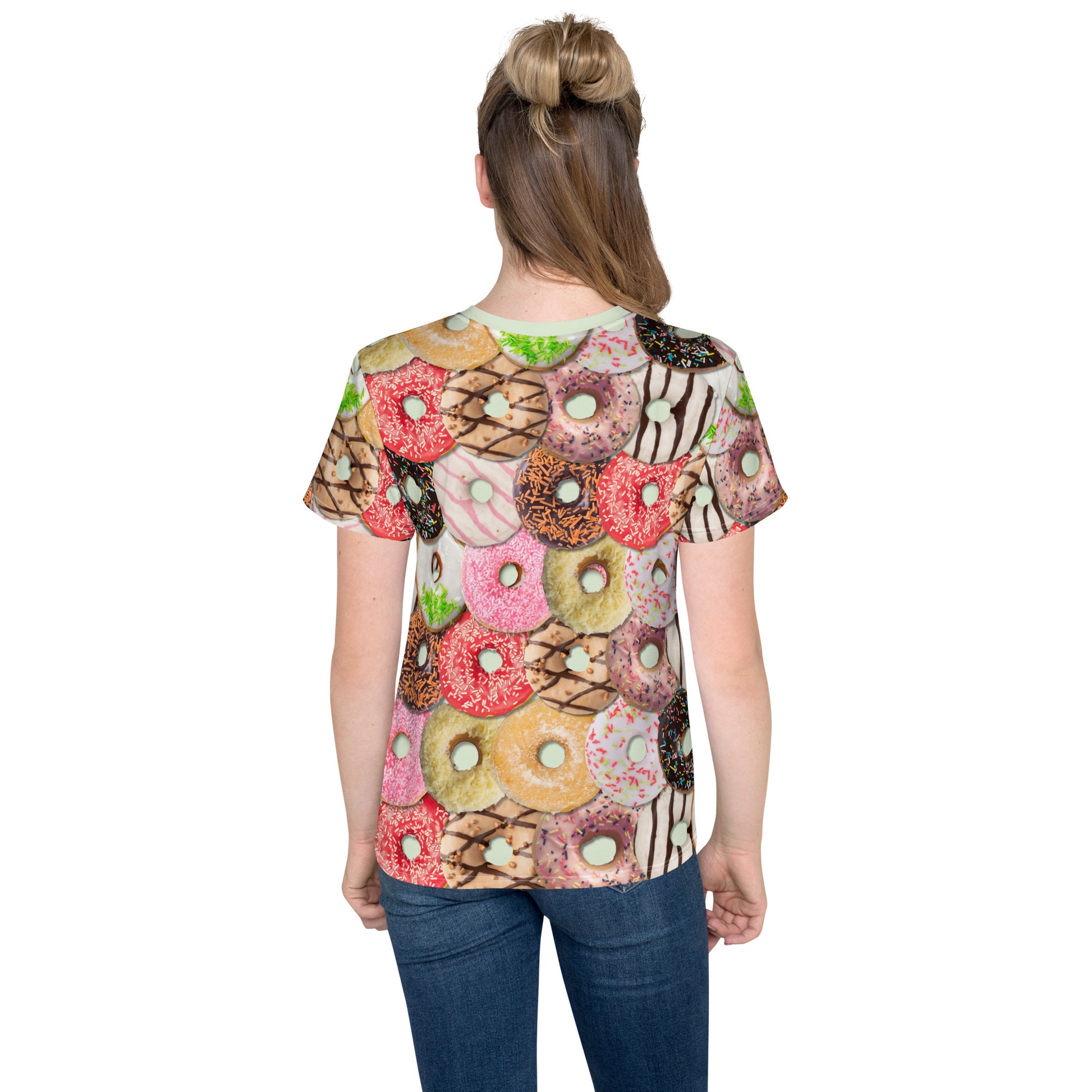 Teenage girl wearing a colourful iced doughnuts all over print T-shirt, rear view.