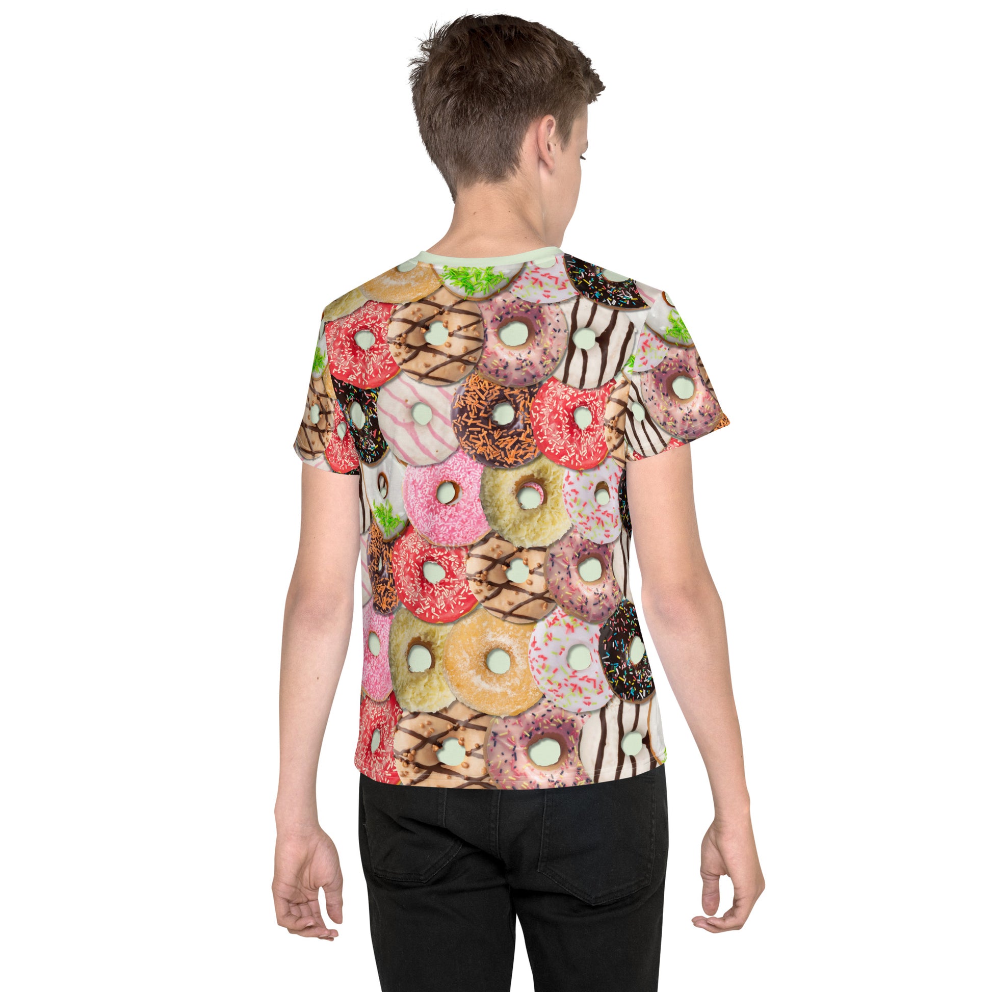 Teenage boy wearing a colourful iced doughnuts all over print T-shirt, rear view.