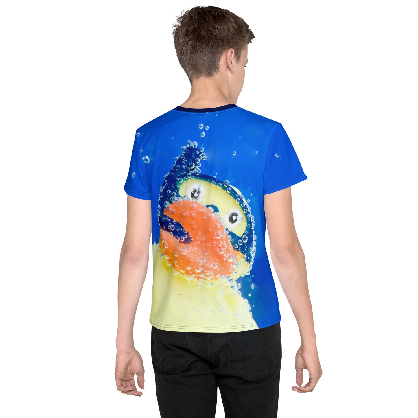 Teenage boy wearing an All over print Rubber Duck Snorkelling Underwater T-shirt, rear view.