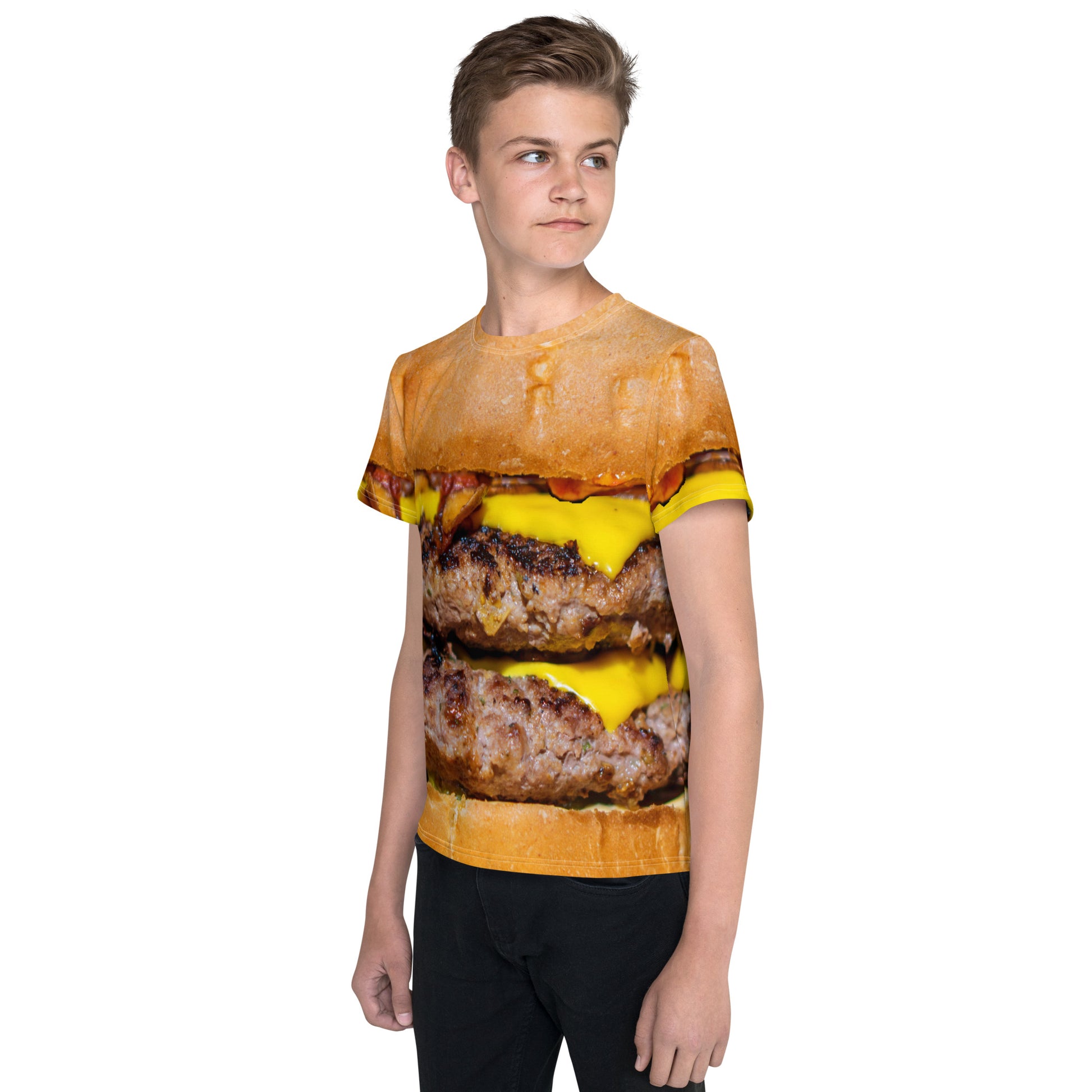 Boy wearing cheeseburger all over print T-shirt, front left view