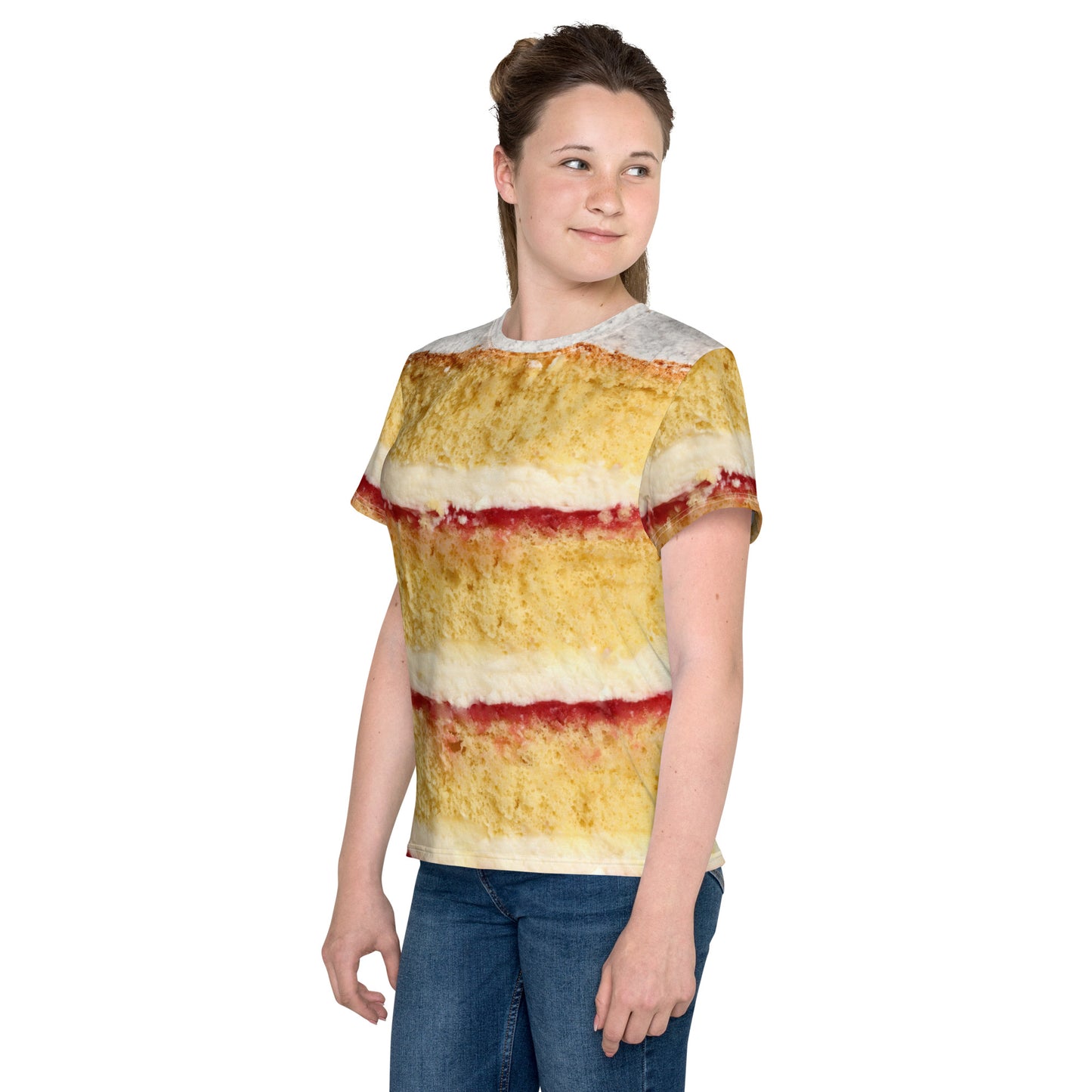 Teenage girl wearing a Youth Victoria Sponge Cake layers all over print T-shirt front left view