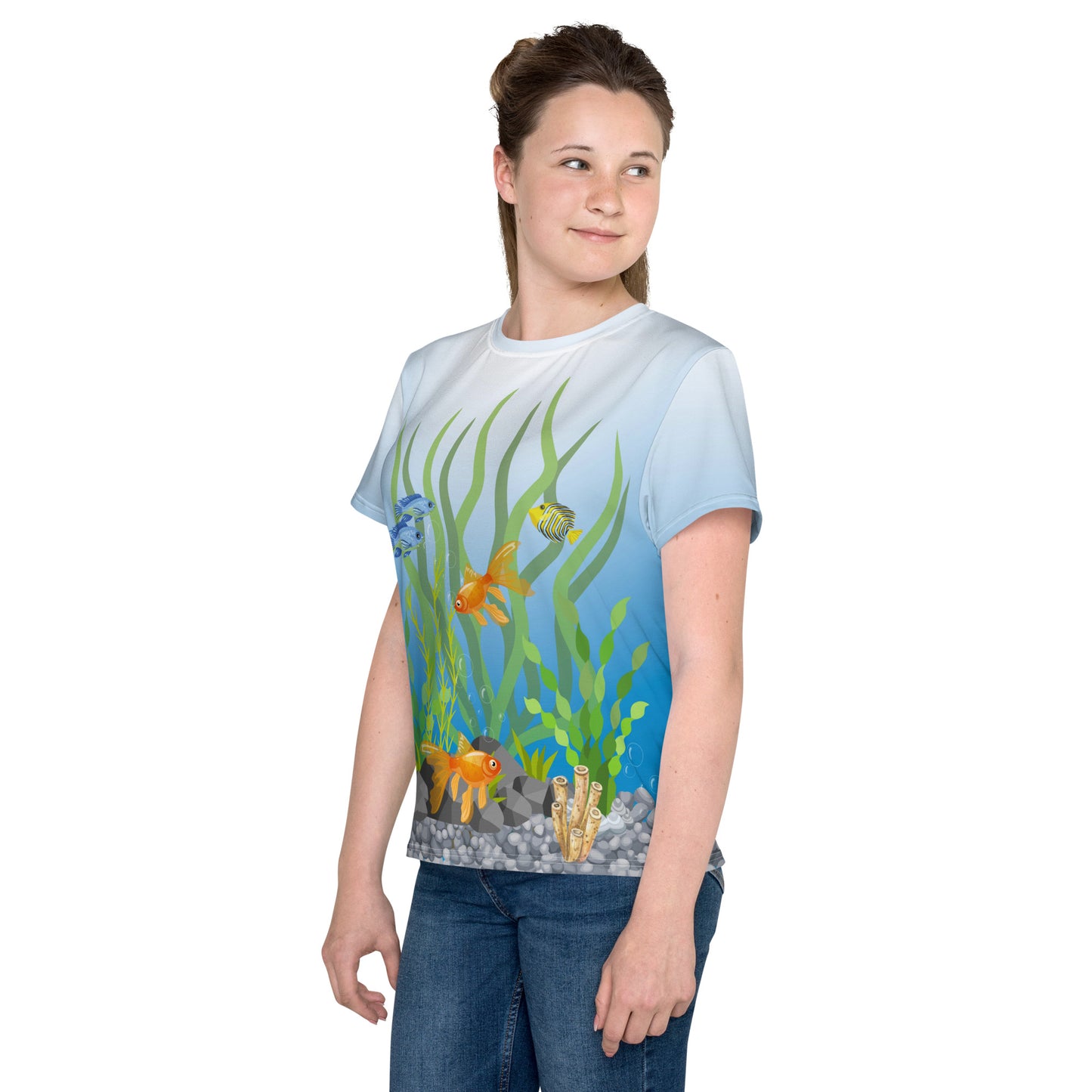 Teenage girl wearing an all over print tropical fish aquarium scene T-shirt, front left view.