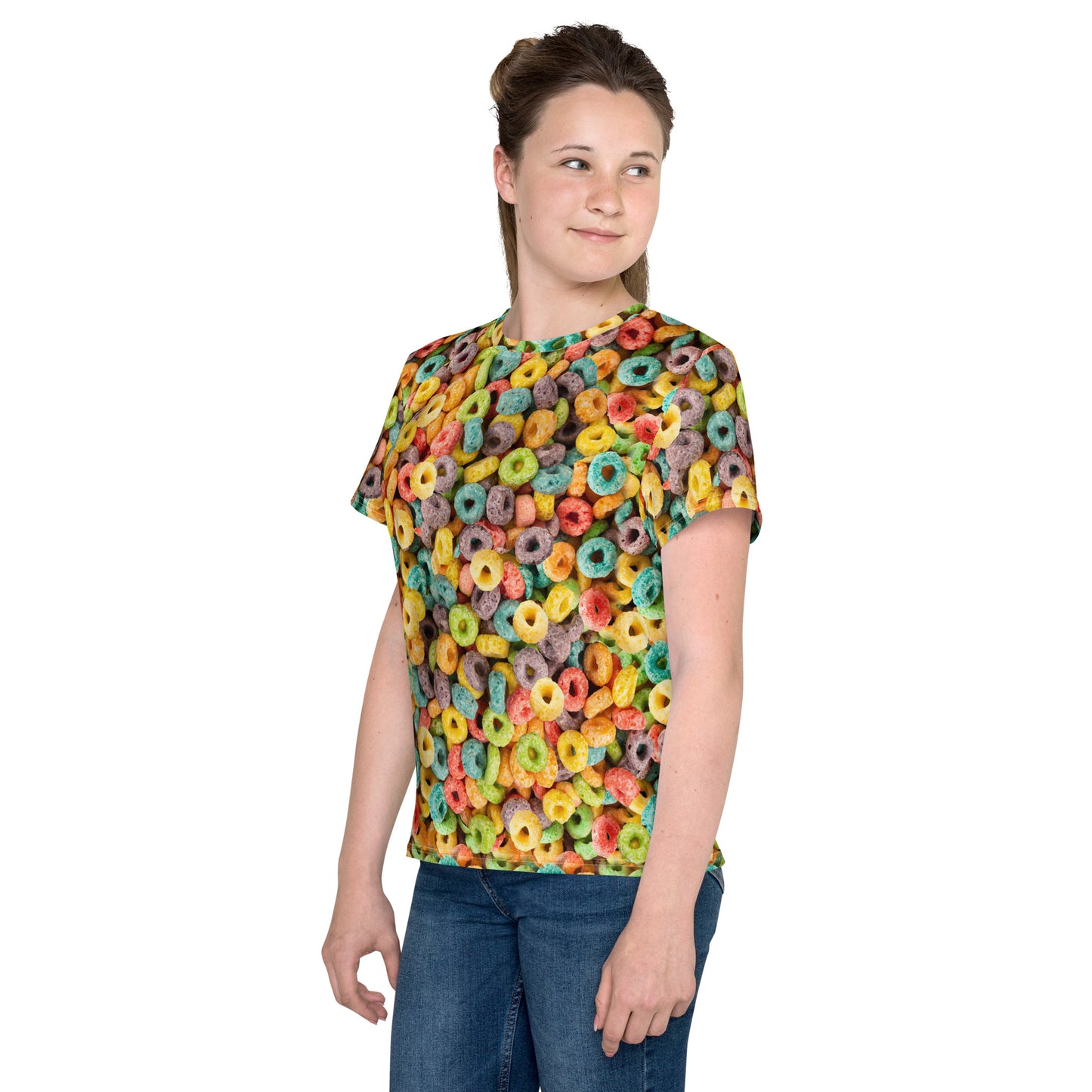 Teenage girl wearing fruity cereal hoops all over print T-shirt front left view