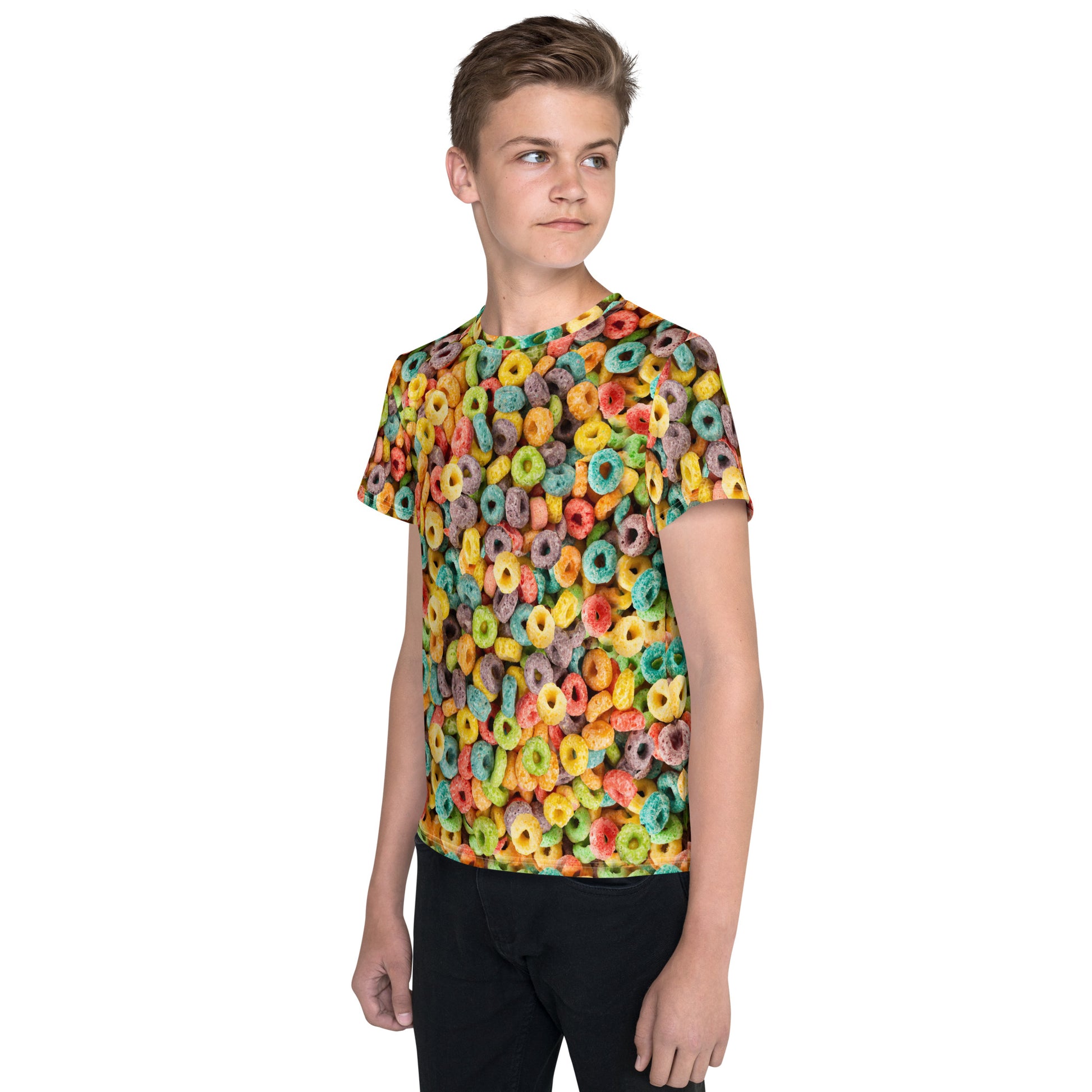 Teenage boy wearing fruity cereal hoops all over print T-shirt left view