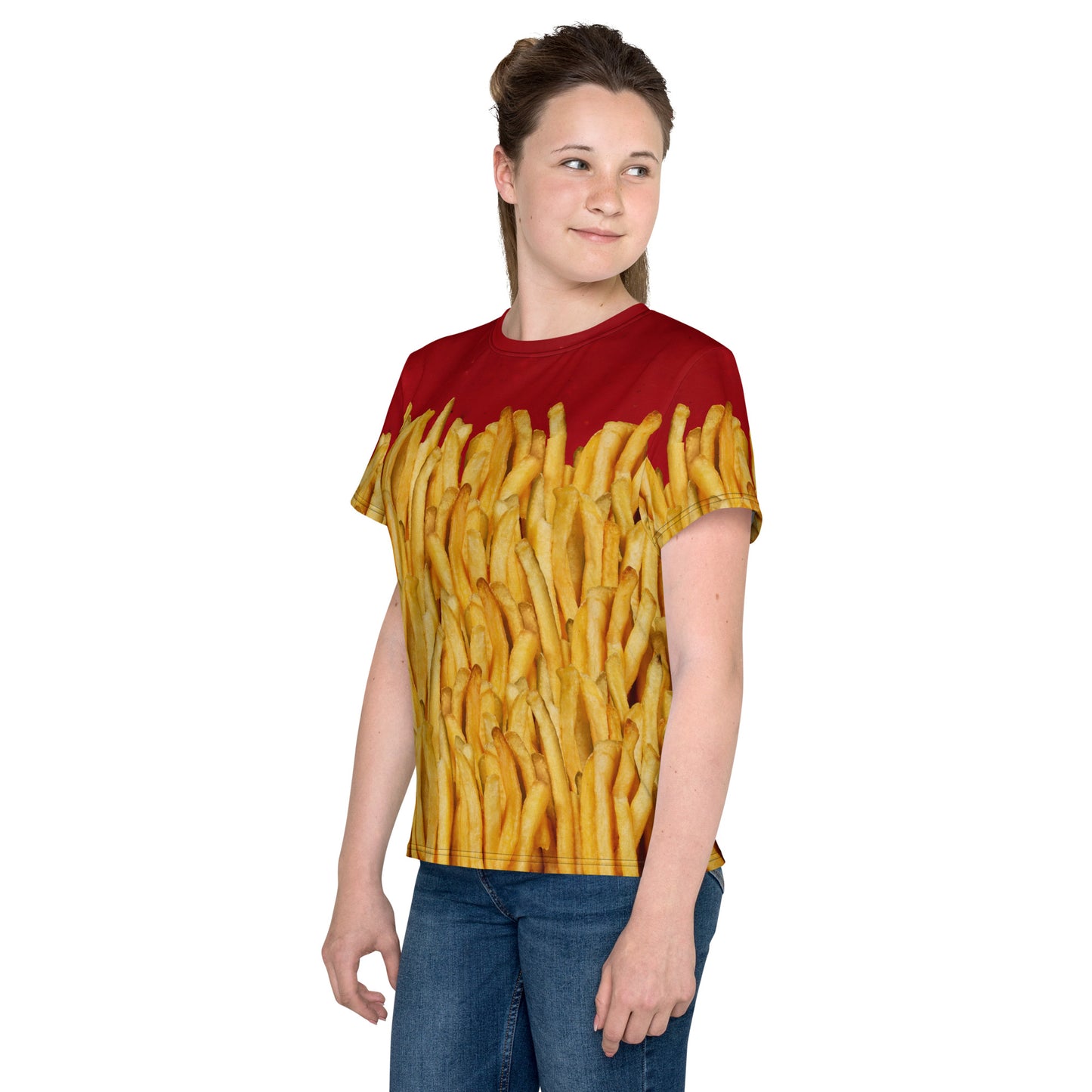 Teenage girl wearing a french fries and ketchup all over print T-shirt, left side view.