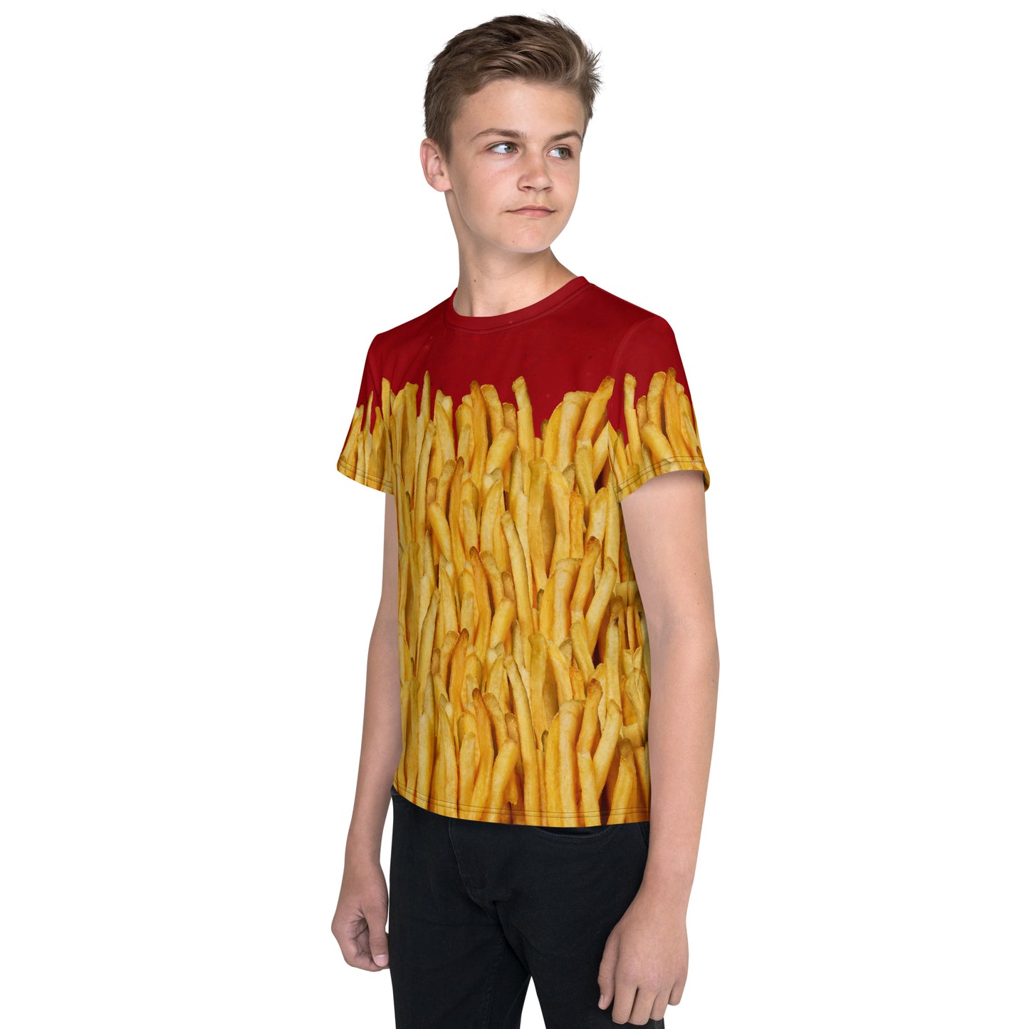 Teenage boy wearing a french fries and ketchup all over print T-shirt, left front view.