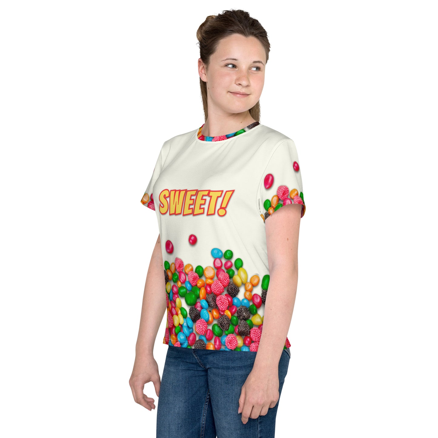 teenage girl wearing sweet as candy sugar high all over print t-shirt, front left view.