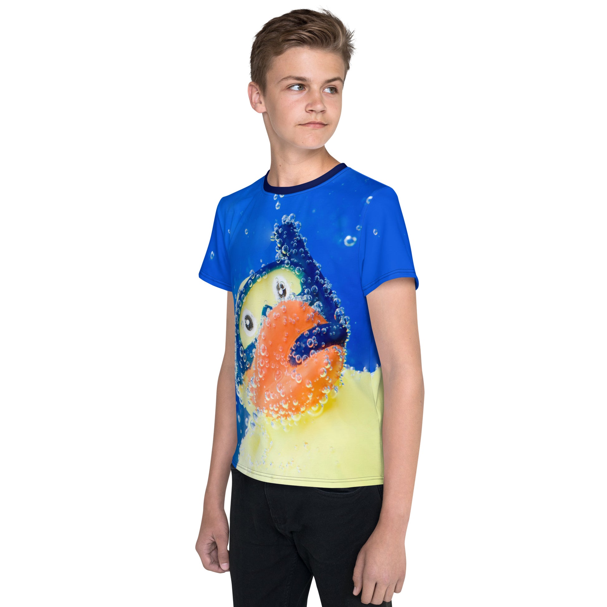 Teenage boy wearing an All over print Rubber Duck Snorkelling Underwater T-shirt, front left view.