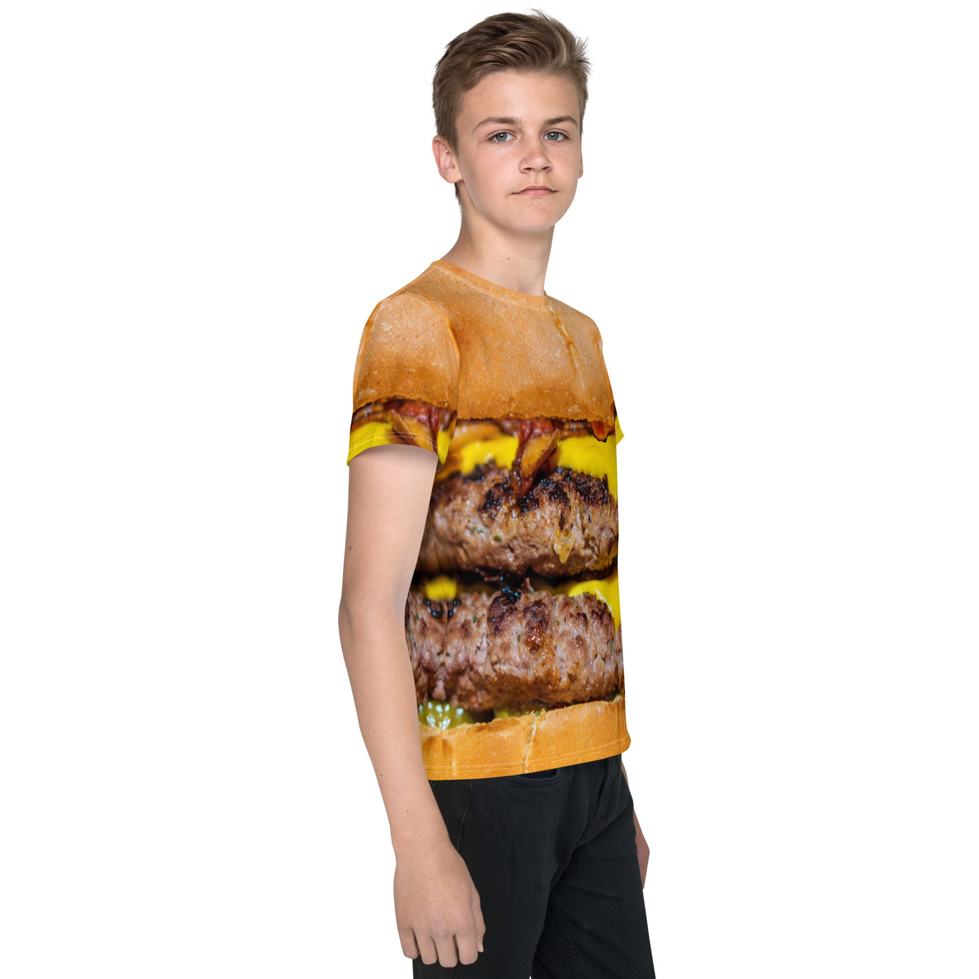 Boy wearing cheeseburger all over print T-shirt, front right view