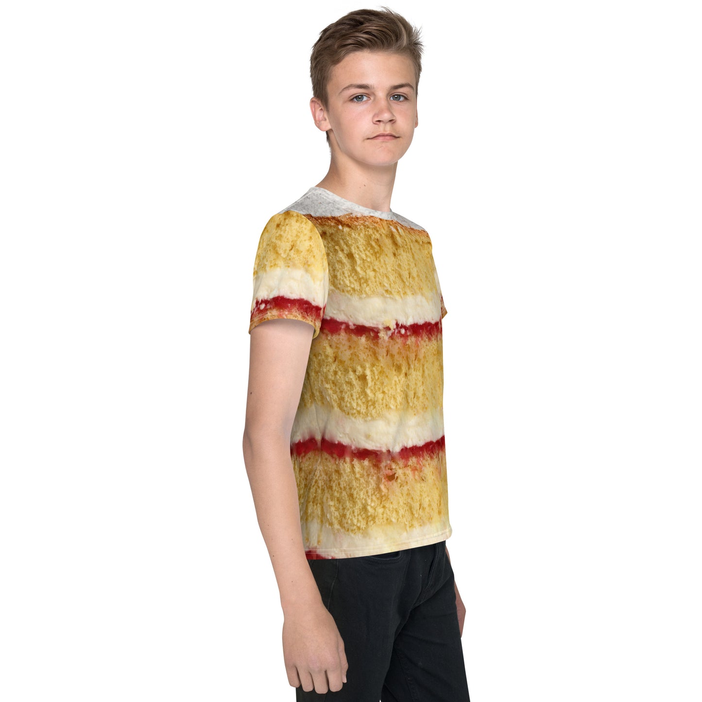 Teenage boy wearing a Victoria Sponge Cake layers all over print T-shirt, front right view