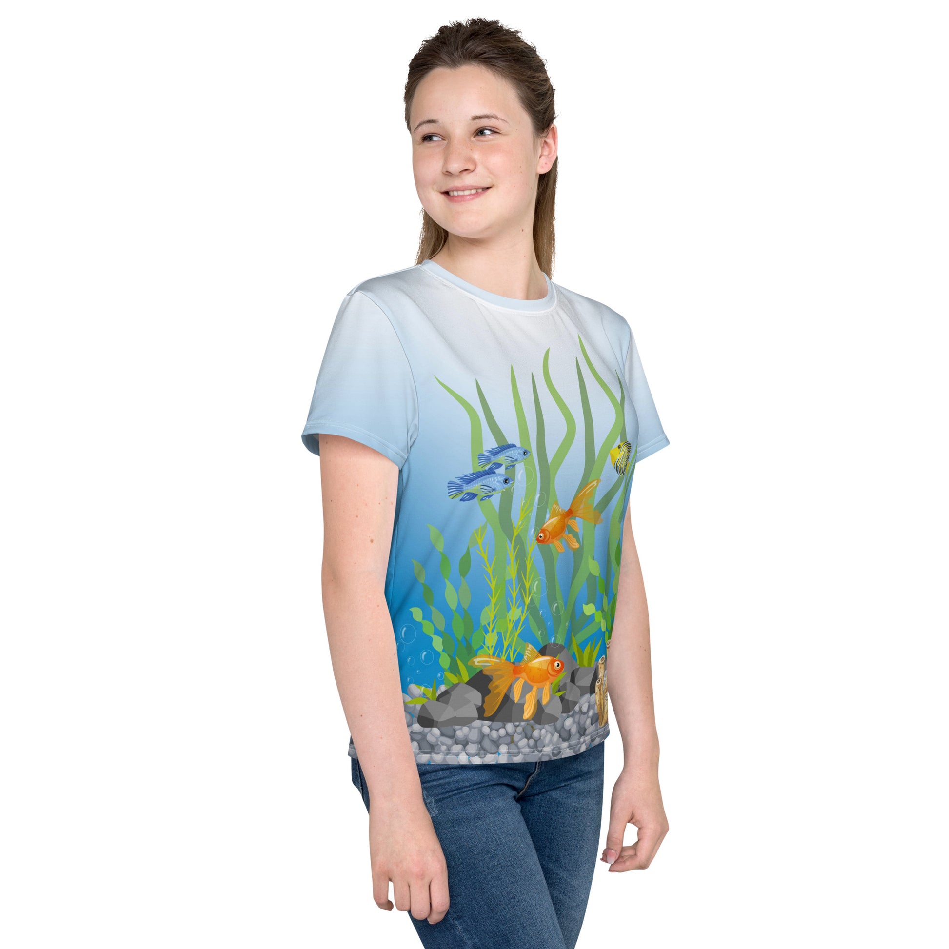 Teenage girl wearing an all over print tropical fish aquarium scene T-shirt, front right view.