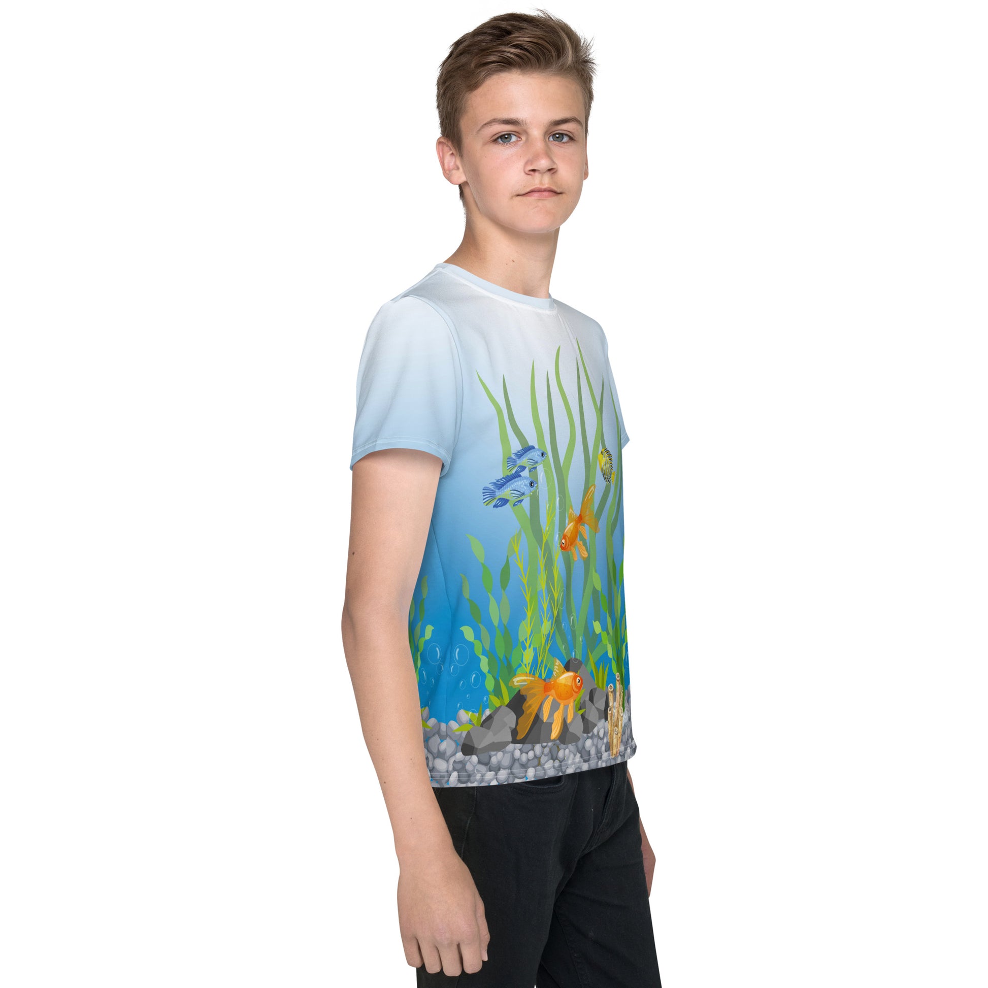 Teenage boy wearing an all over print tropical fish aquarium scene T-shirt, right side view.