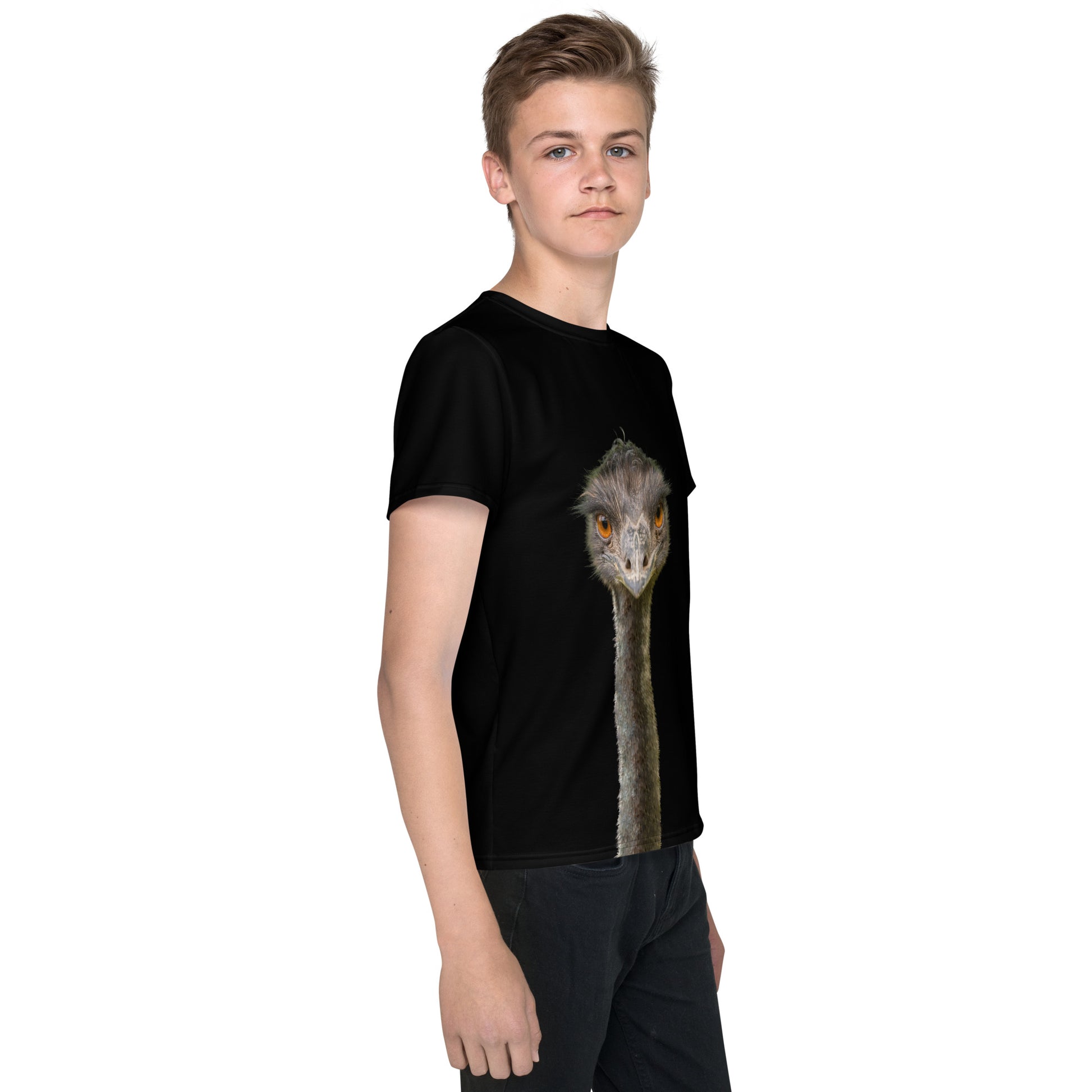 Teenage boy wearing a black T-shirt with an Emus head and neck on the back and front, right side view