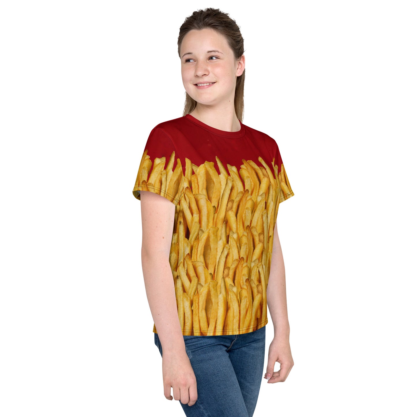 Teenage girl wearing a french fries and ketchup all over print T-shirt, right side view.